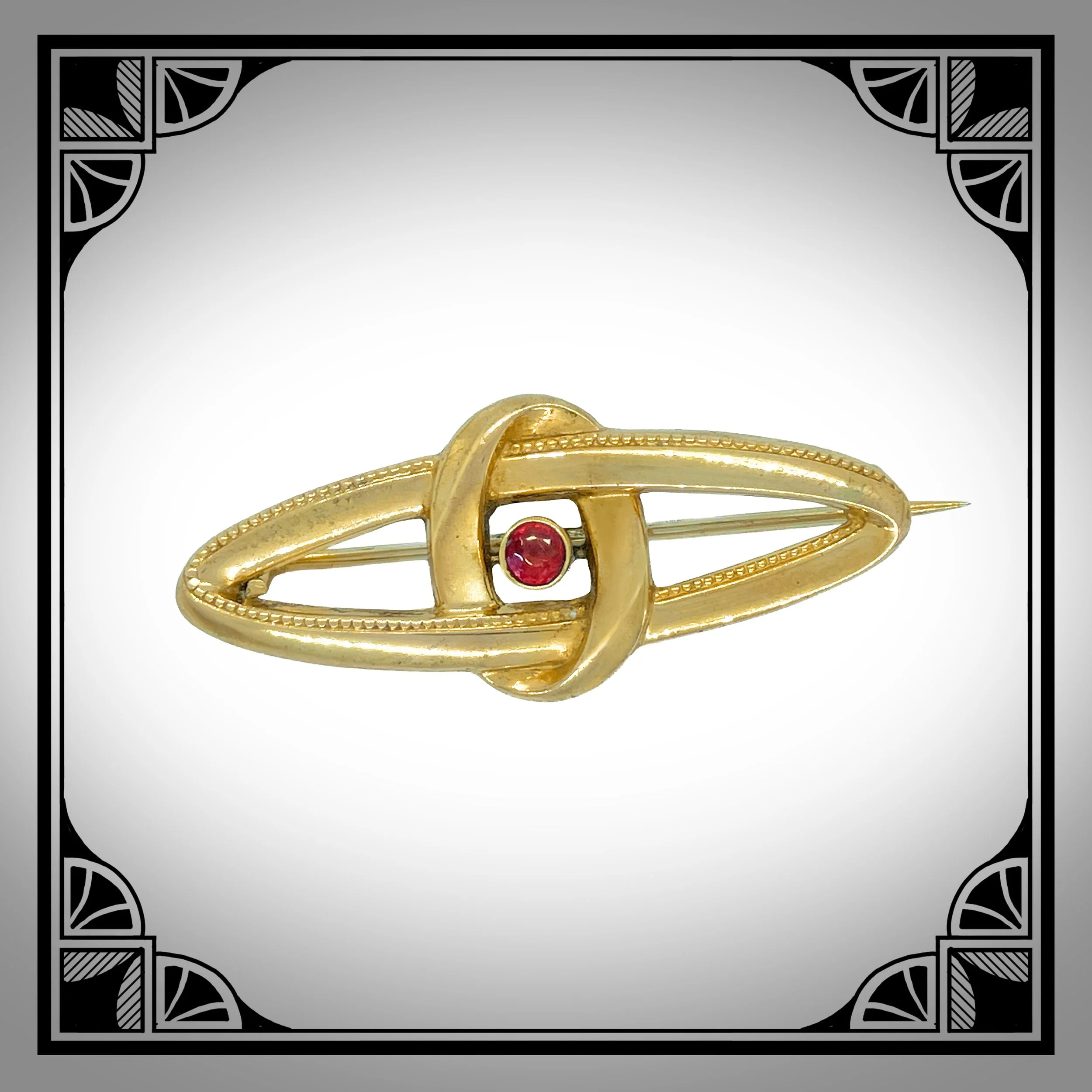 c.1910 German Gold-Plated Ringed Navette Brooch with Red Gemstone