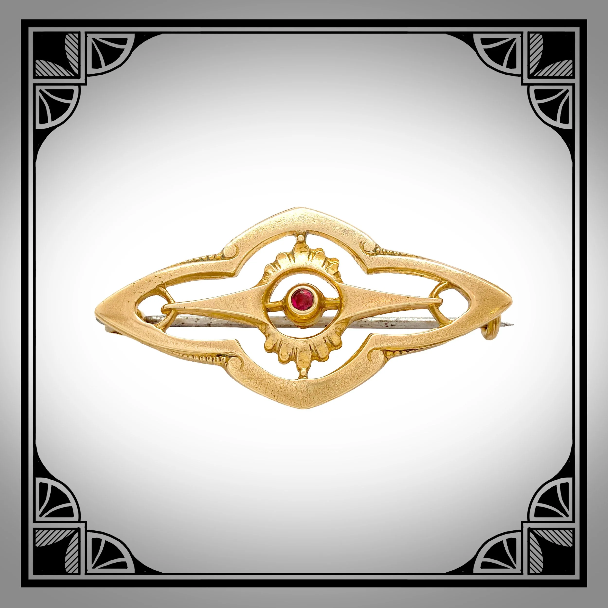1910s Gold-Plated Openwork Brooch with die-struck rocailles, set with red gemstone
