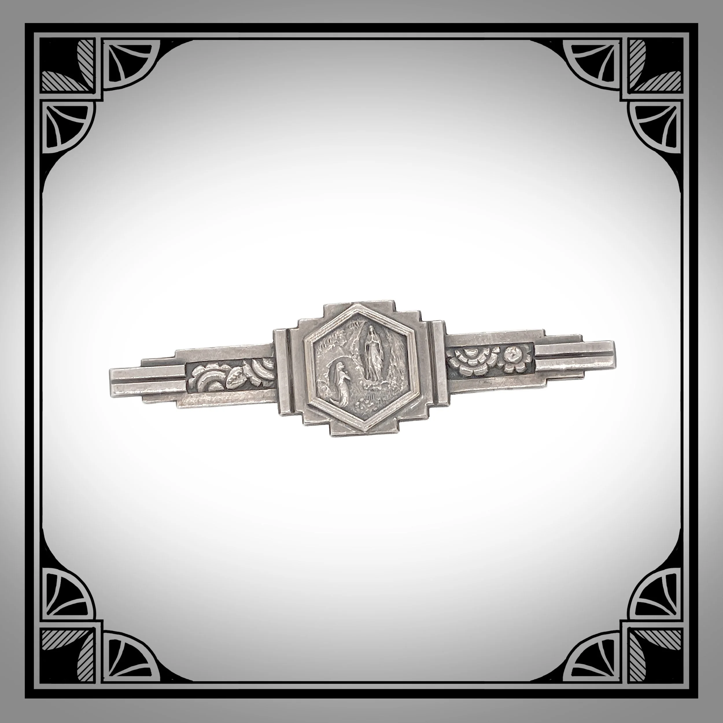 1930s Silver-Plated Relious Art Deco Brooch Depicting Our Lady of Lourdes.jpg