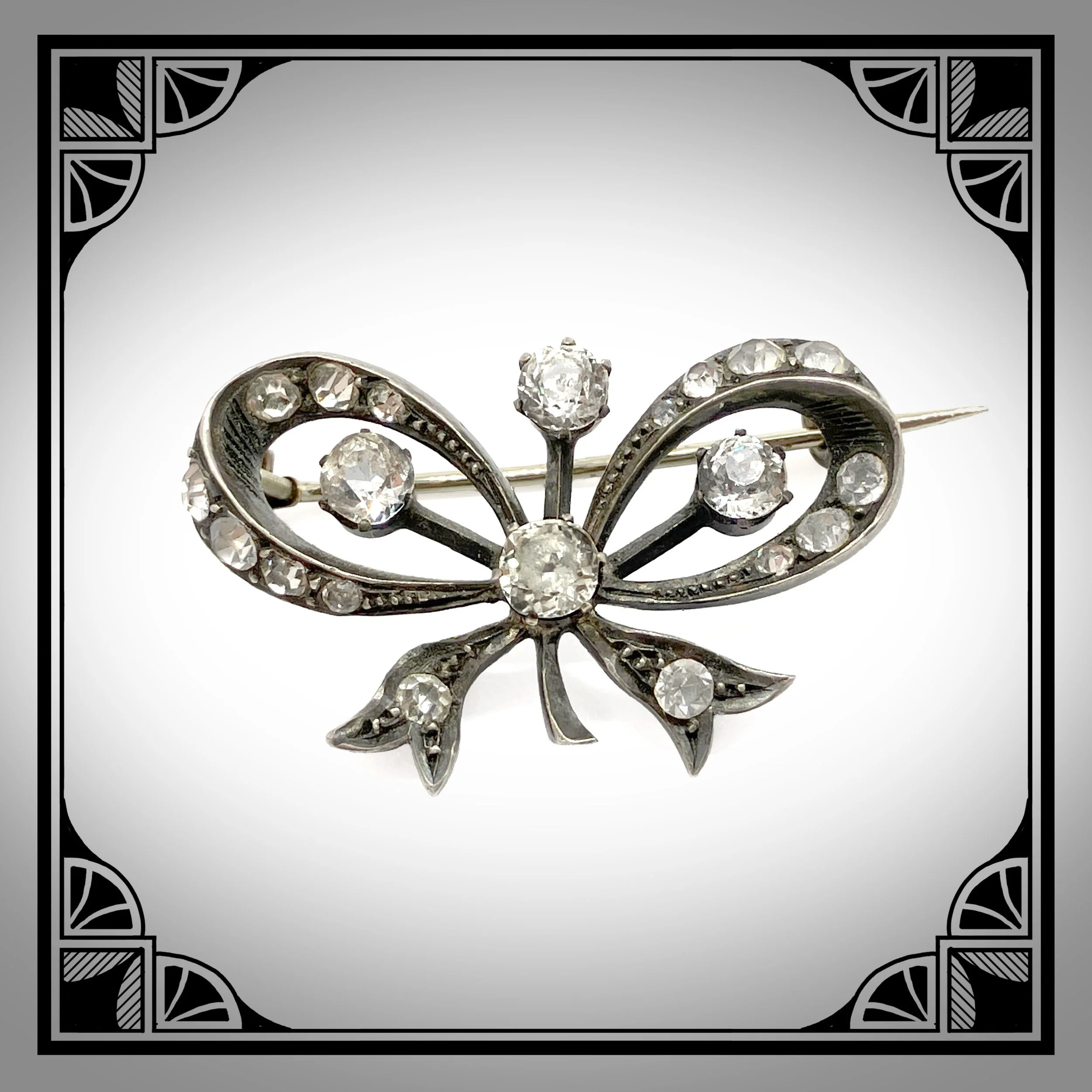 1890s French Silver Ribbon Bow brooch set with brilliant-cut rhinestones