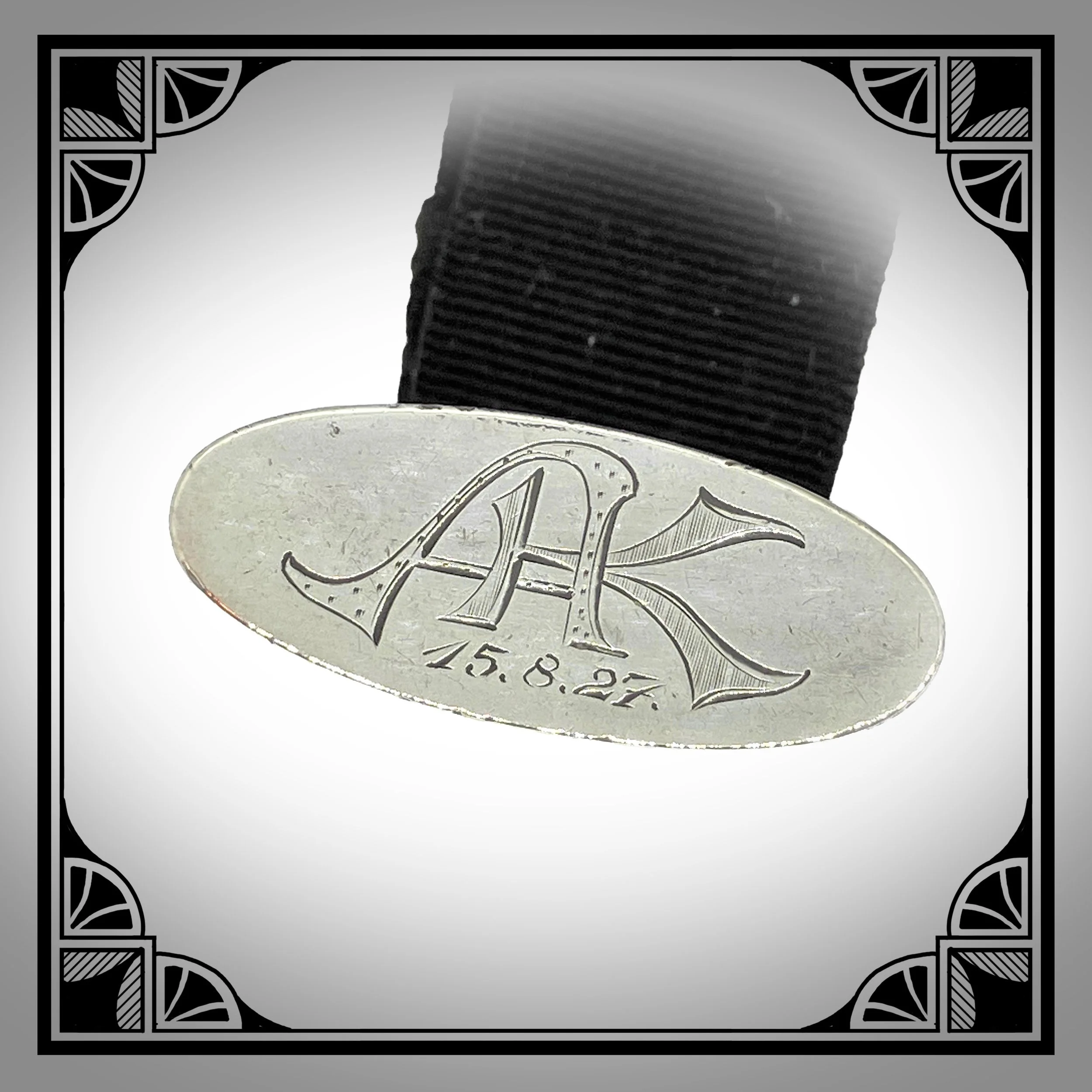 1920s Silver Openwork Ribbon Watch Fob 3.jpg