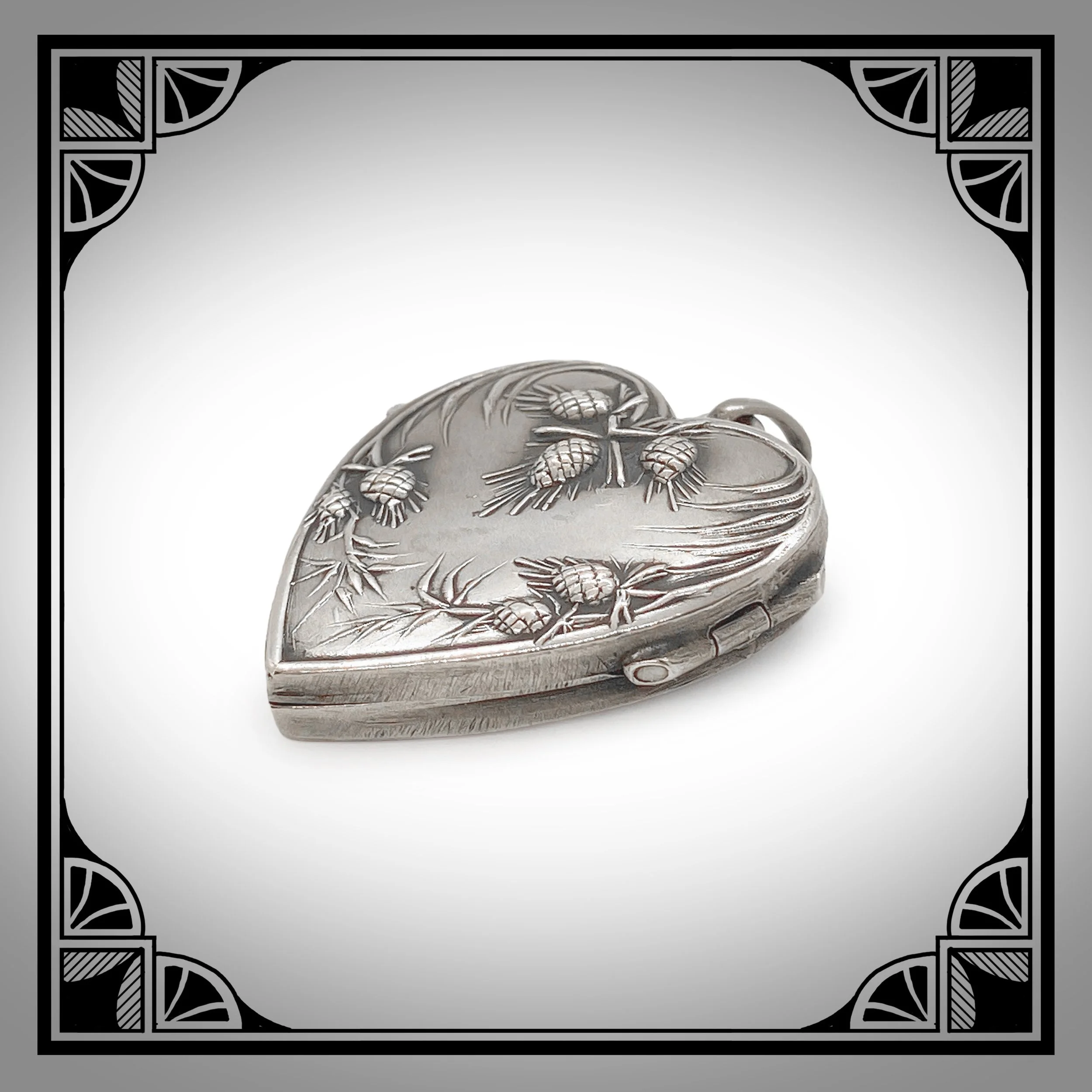 c1910 Silver Art-Nouveau Heart Locket with Pine Branches in raised relief 2.jpg