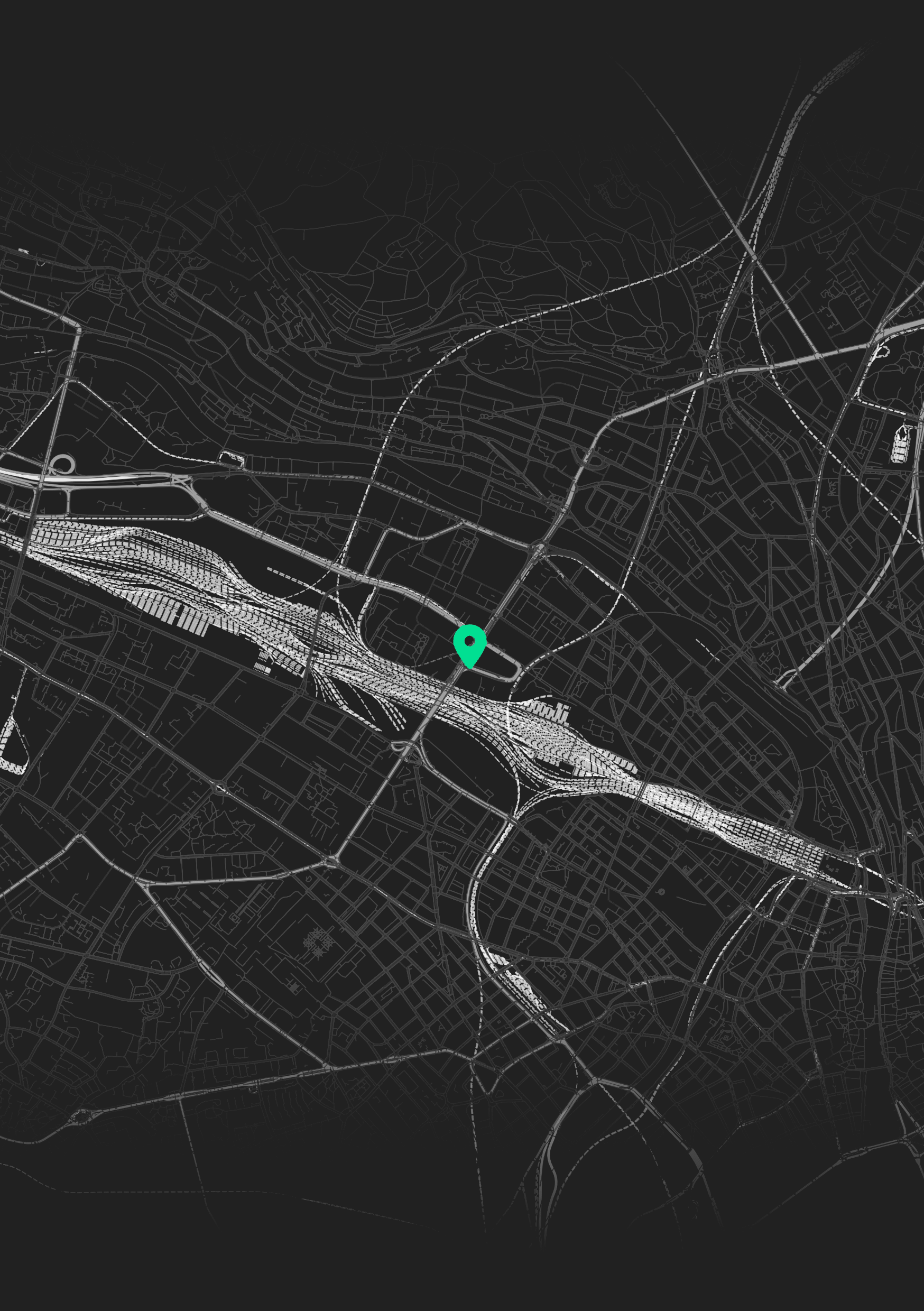 Digital map of a city at night with a green location marker indicating a specific point.