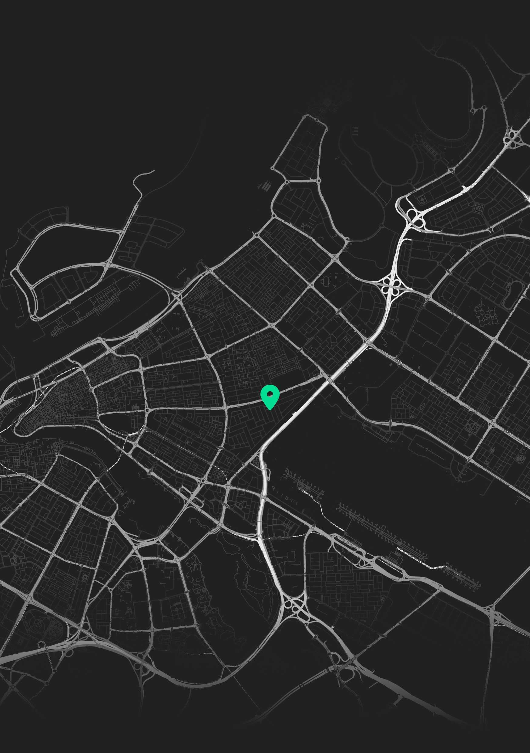 Digital map of a city at night with a teal location marker.