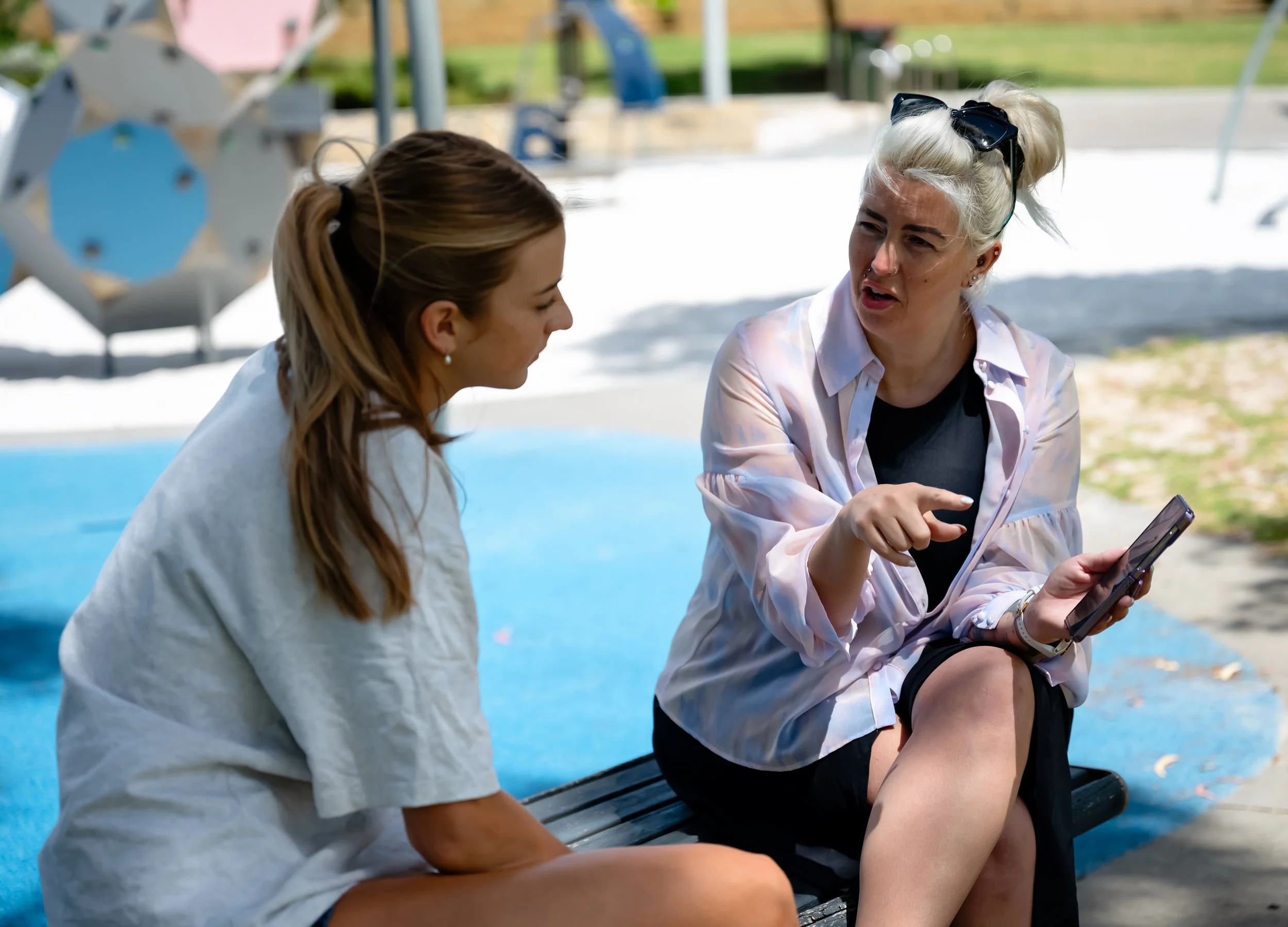 Two women councelling in park