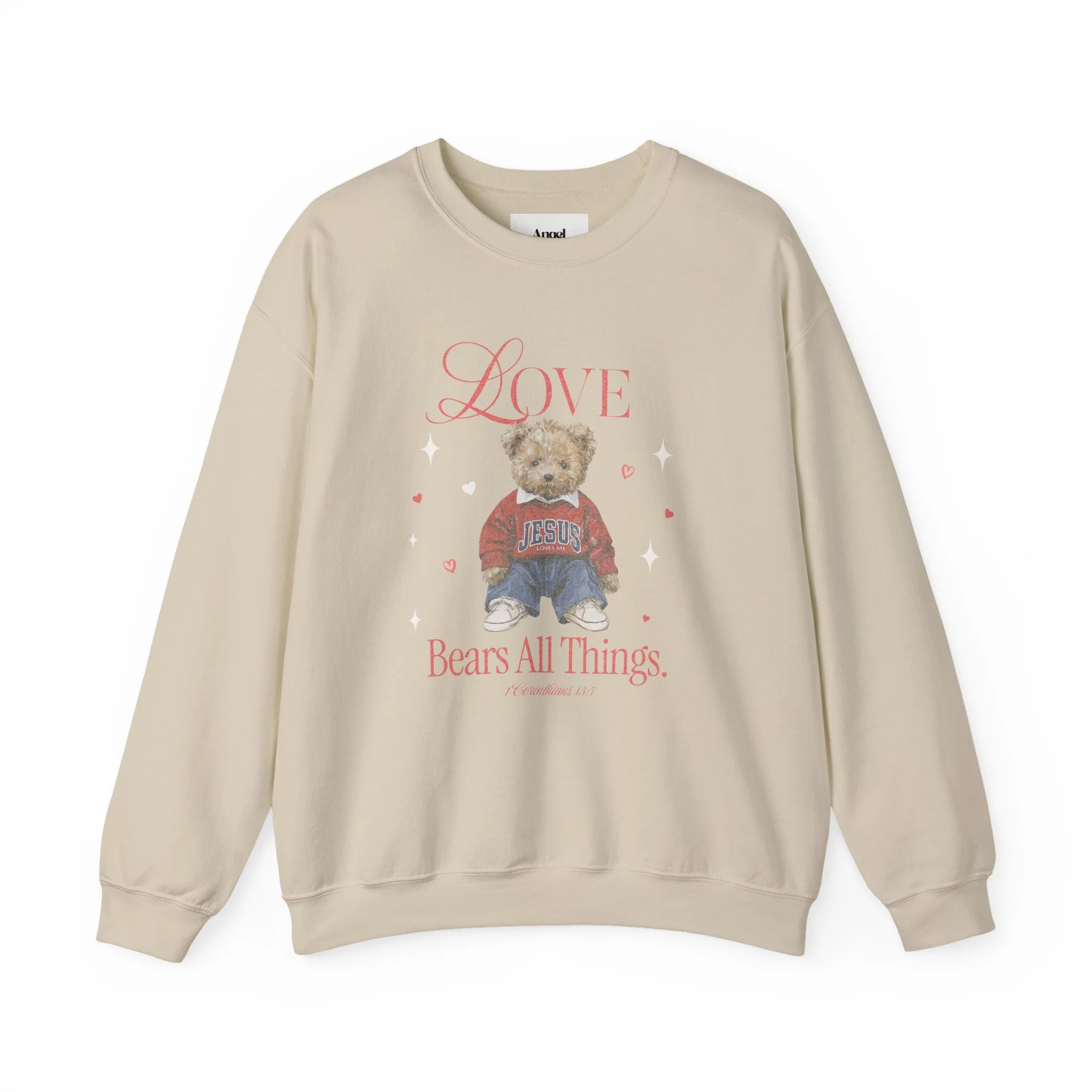 Cream-colored sweatshirt with a teddy bear graphic wearing a red Jesus sweatshirt, surrounded by small hearts and stars, with the text 'Love Bears All Things' and a Bible verse reference.