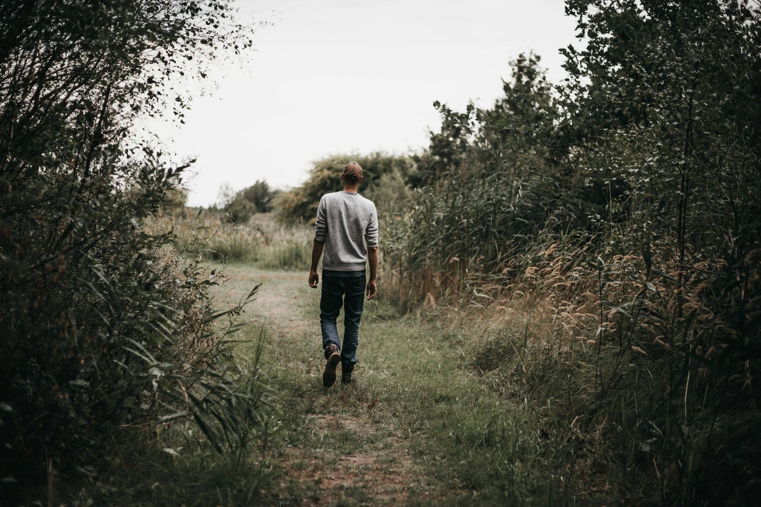 A person walking away from their family, representing family estrangement