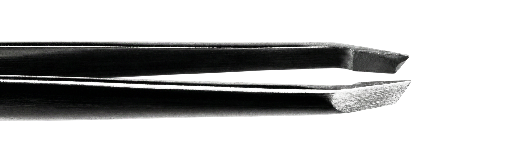 Close-up of a metallic spoon and fork lying parallel on a reflective surface.