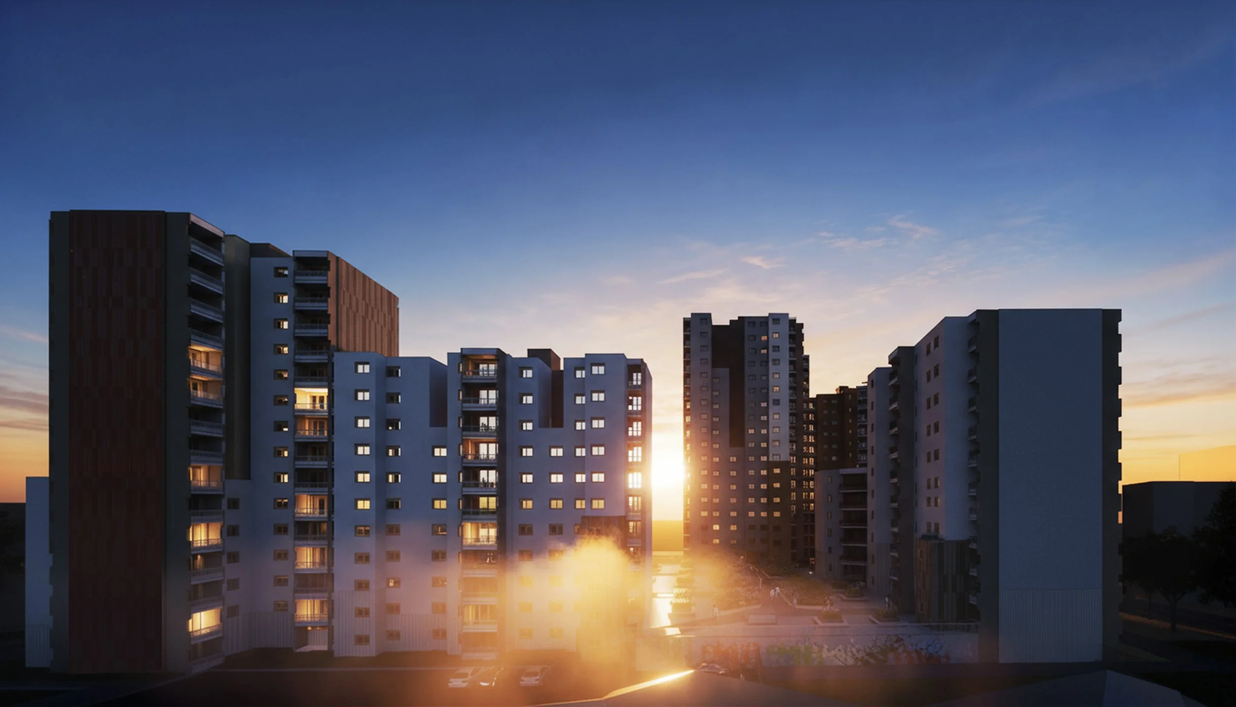 Coucher de soleil derrière un groupe d'immeubles résidentiels modernes.