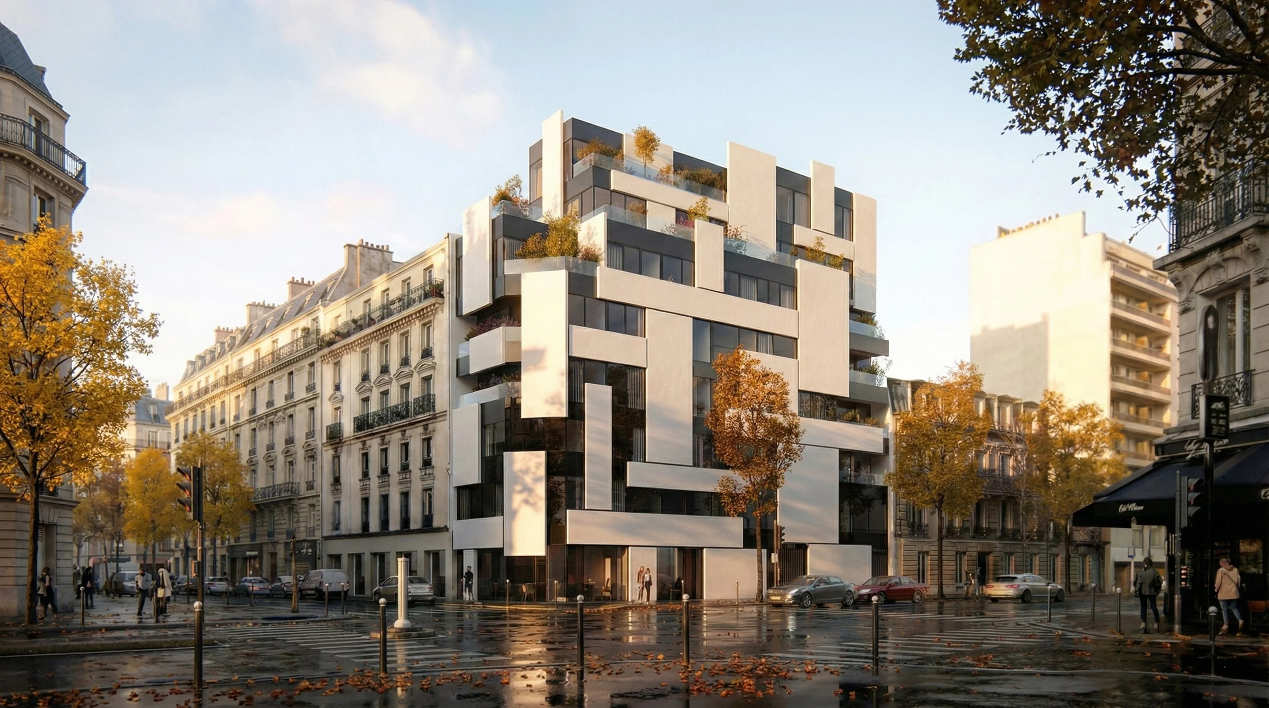 Bâtiment moderne en noir et blanc dans une rue de Paris avec des arbres aux feuilles automnales et des voitures stationnées, sous un ciel en fin d'après-midi.