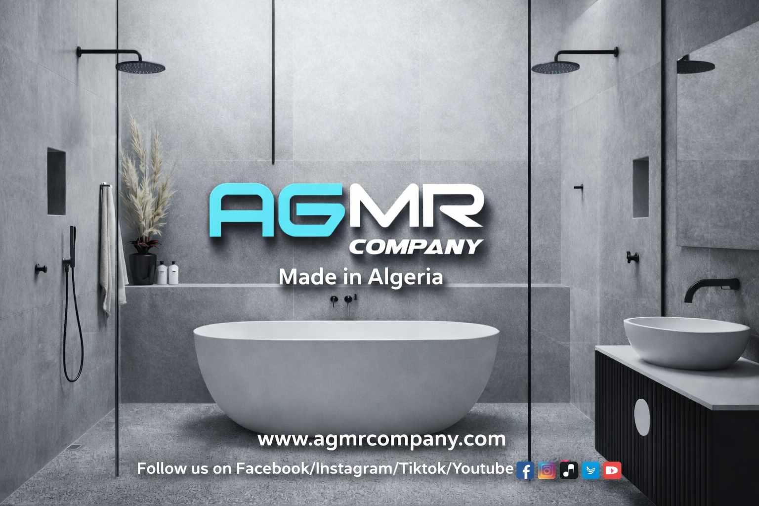 Modern bathroom with gray tiled walls and floors, featuring two showerheads, a large freestanding bathtub, a side sink with a vessel basin, and decorative elements including a black vase with pampas grass and soap dispensers. The company logo 'AGMR COMPANY' and website are displayed on the wall.