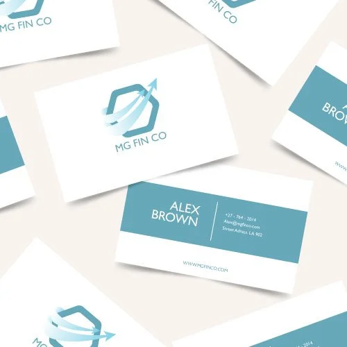 A collection of business cards, one prominently displaying the name Alex Brown, contact information, and website, with a logo featuring an arrow intertwined with a hexagon shape.