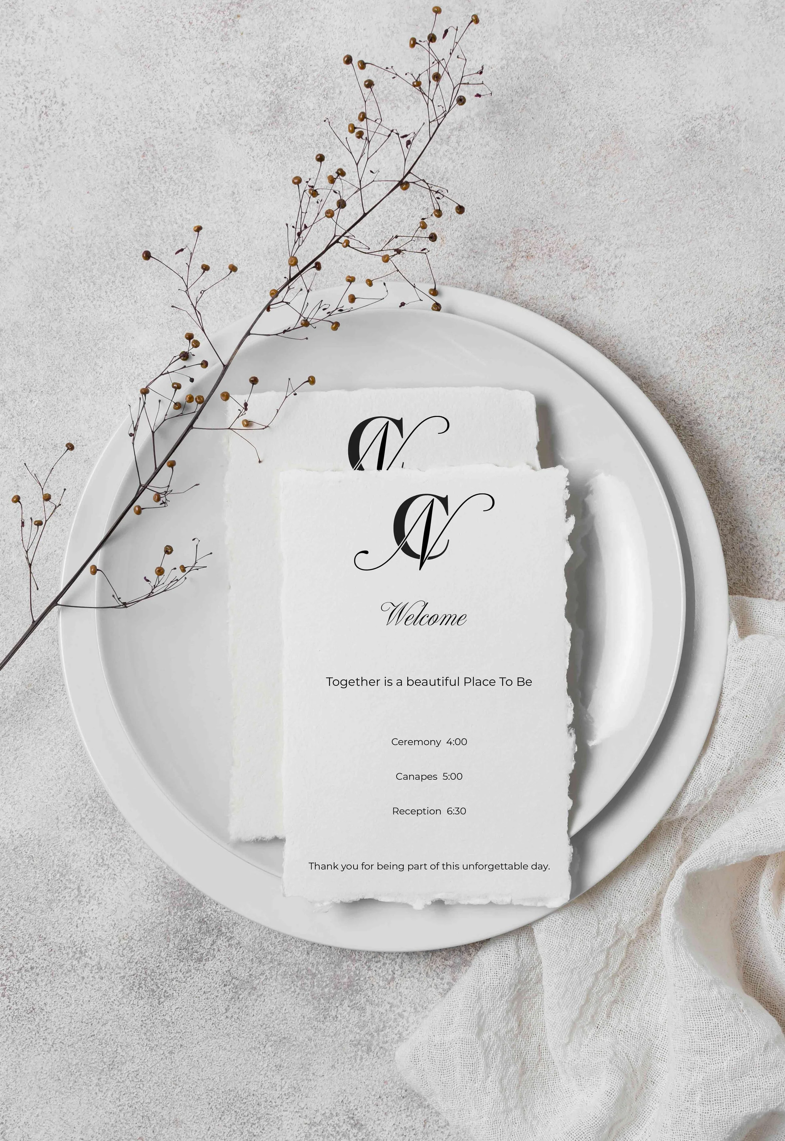 Wedding or event program on torn white paper with black calligraphy, placed on a white tray with a sprig of dried berries, set on a textured light surface with a soft fabric. The program includes schedules for ceremony, canapes, and reception, with a