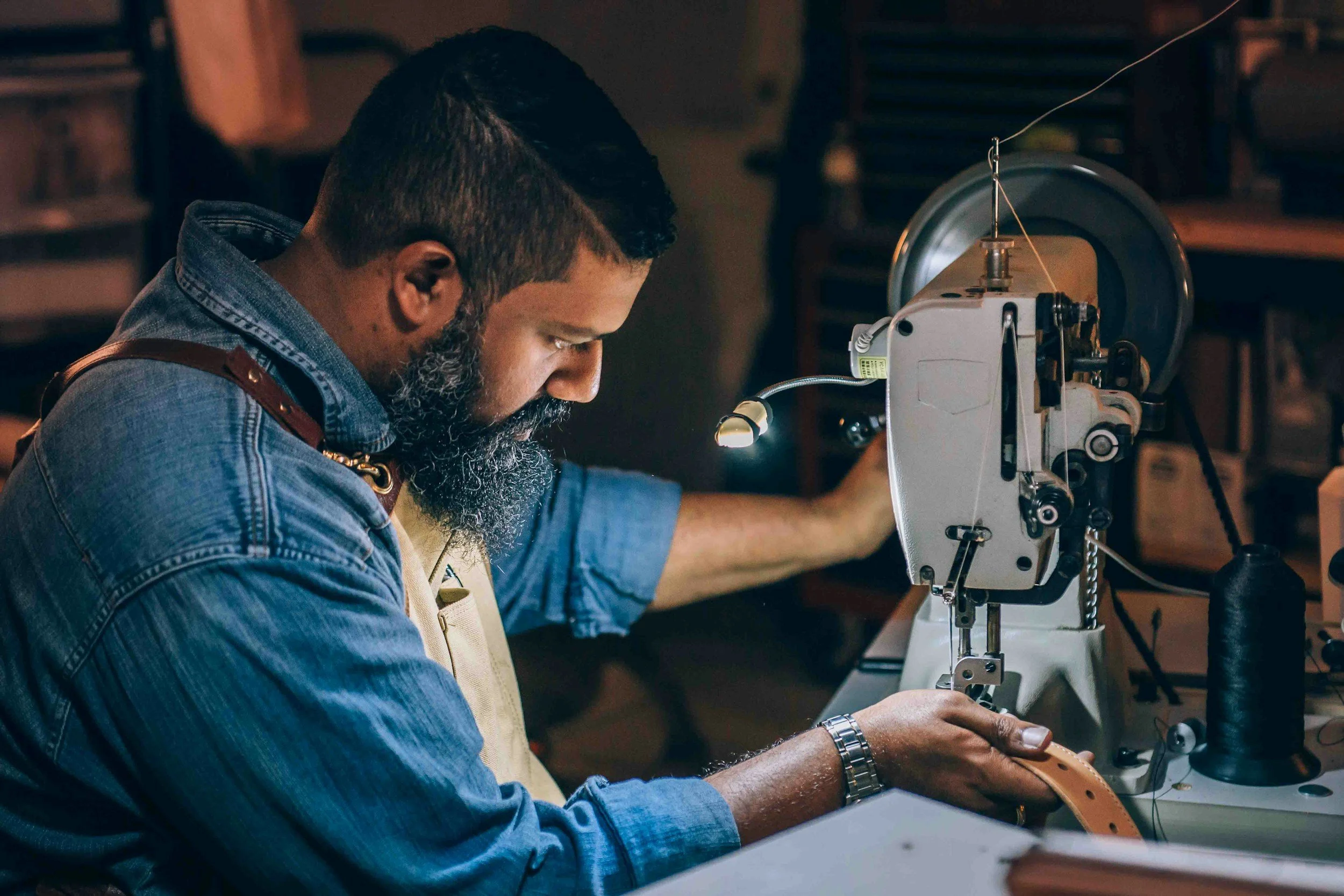 Man working on a sewing machine