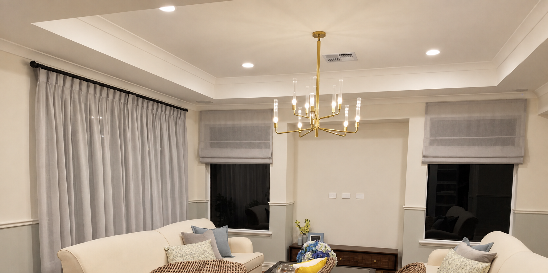 Custom grey sheer curtains and Roman blinds in a Perth living room, made by Glorious Home Decor