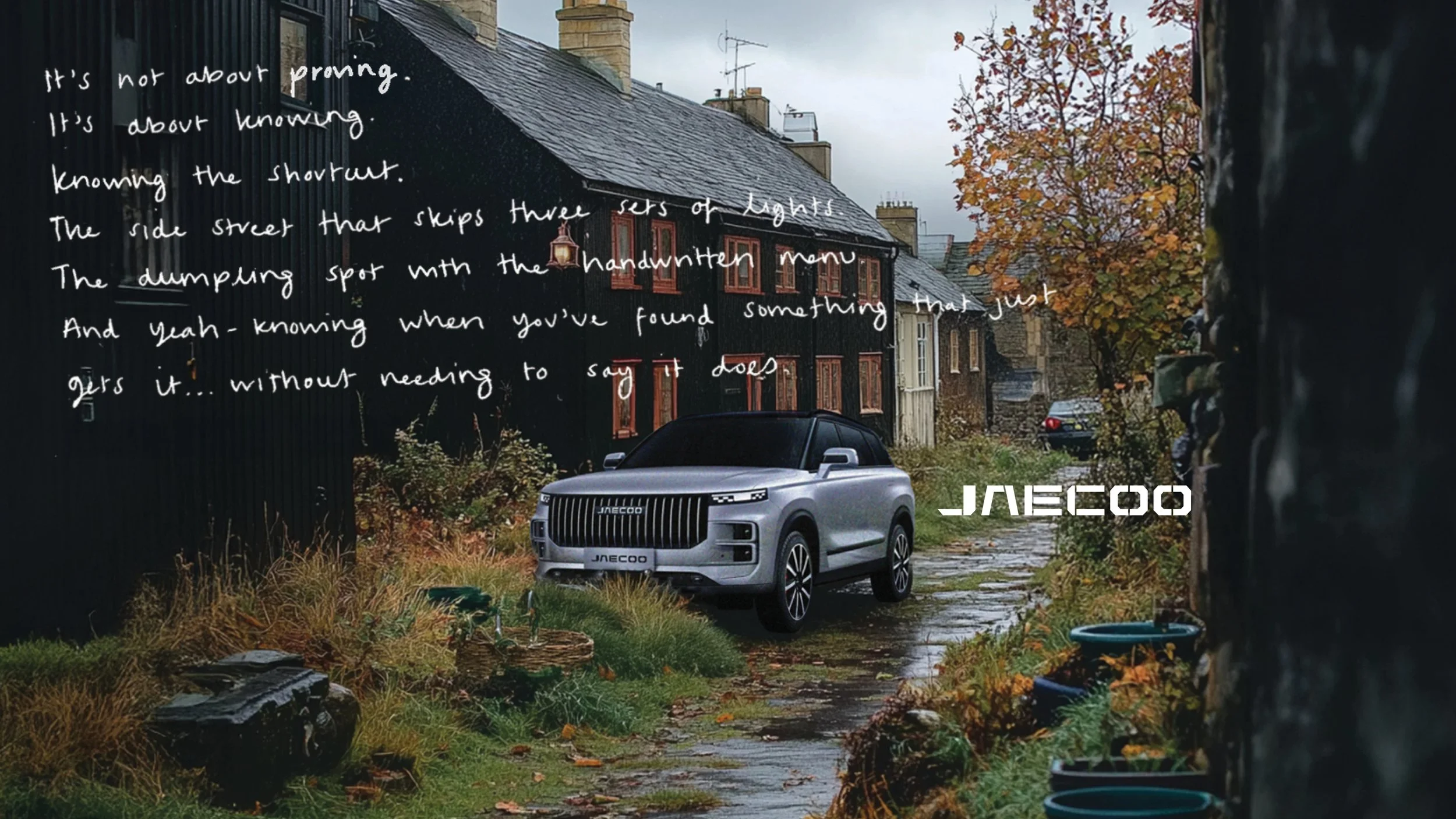 An outdoor scene in a residential area with a modern silver SUV parked on a narrow, wet, stone-paved path surrounded by greenery, plants, and a black wooden fence on the left. There are old brick houses and trees with orange and yellow leaves in the 