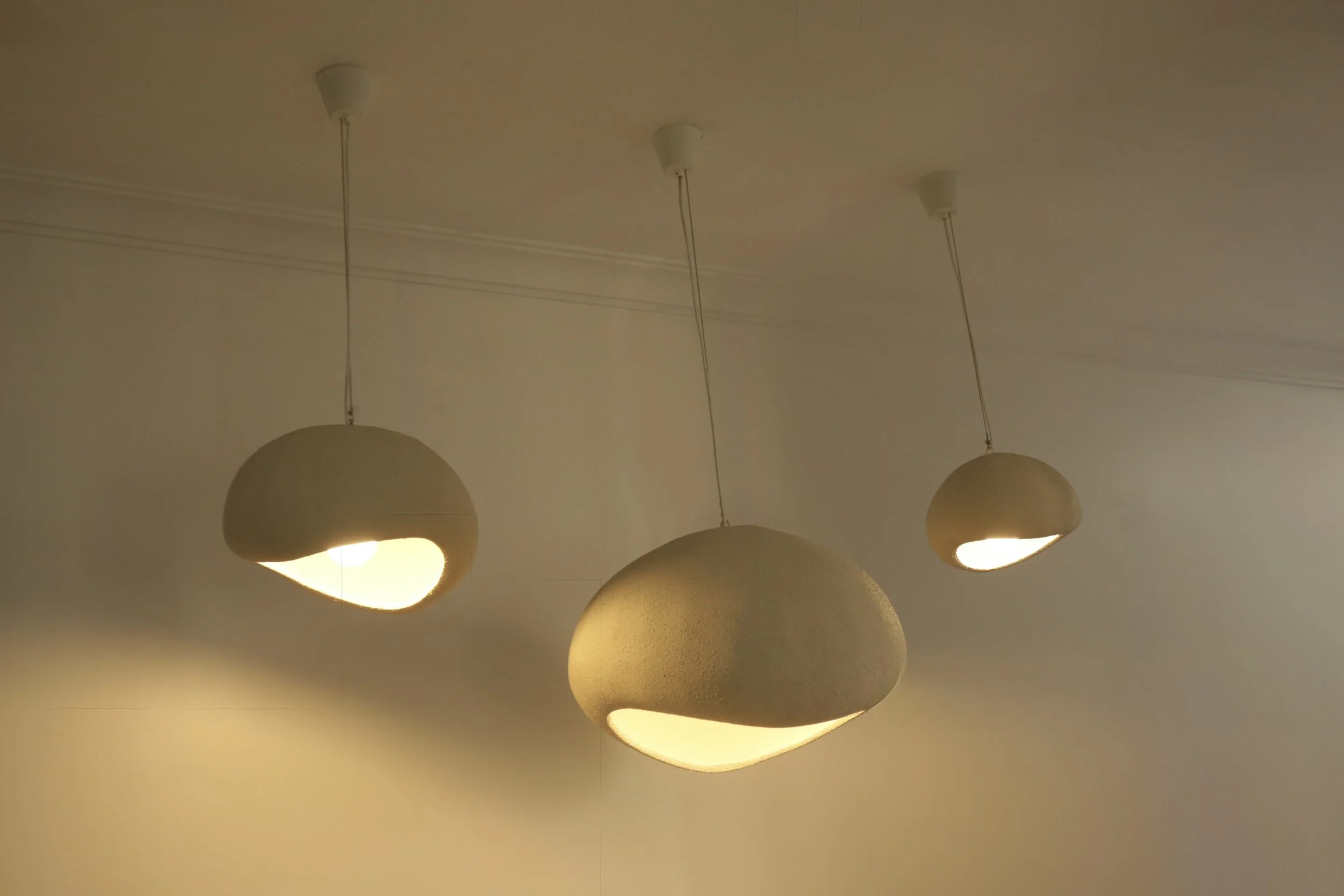 Clean, modern cloud lights that offer understated elegance and functional lighting for kitchens and dining areas.