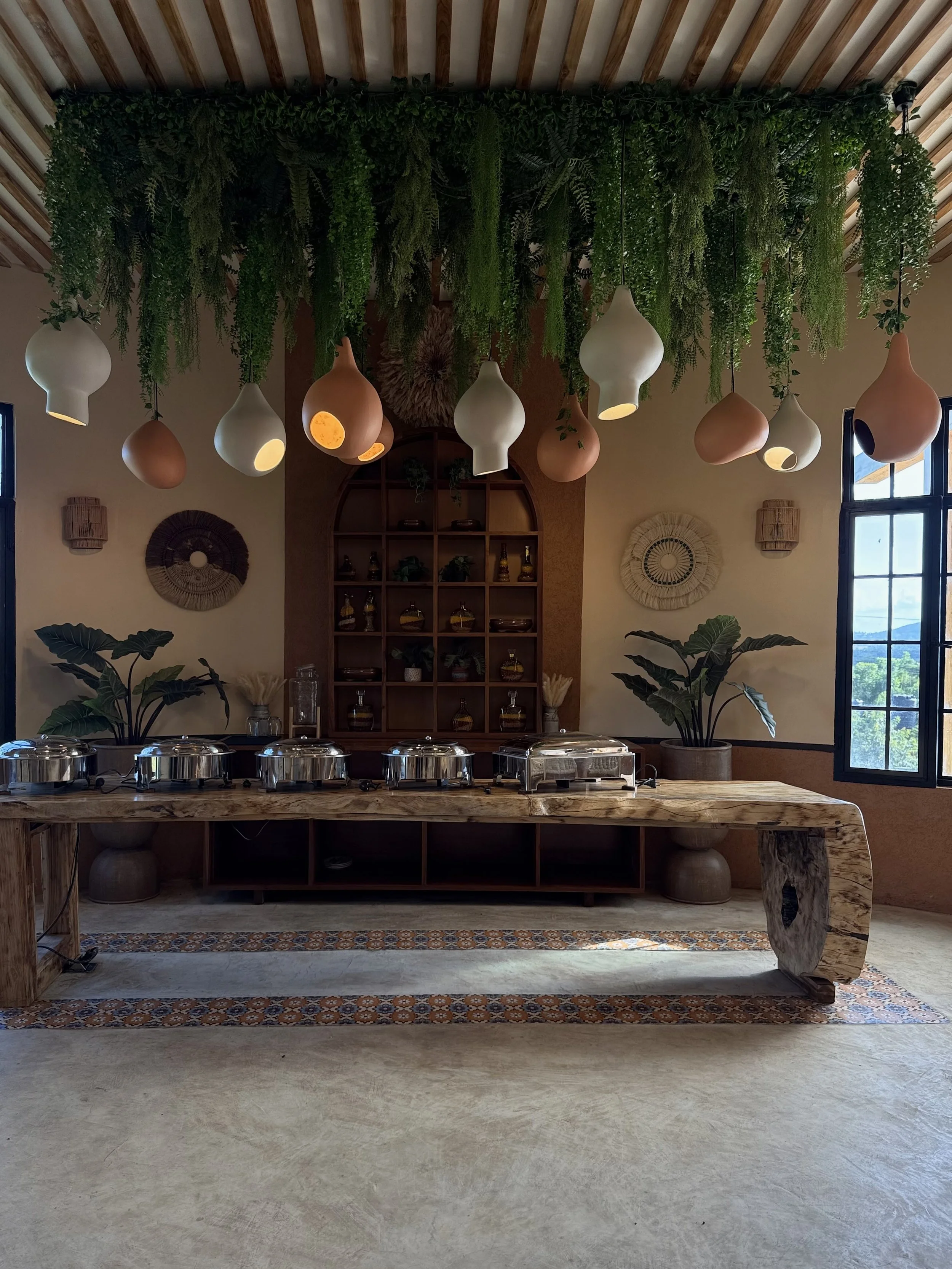 Nest project Inspired by nature, this  blends molden lighting with greenery to create a welcoming, earthy atmosphere for dining and gathering spaces.