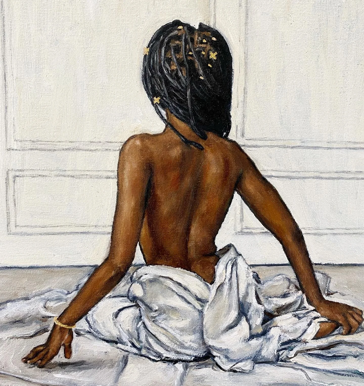 A painting of a woman with dark hair, sitting on a bed with white sheets, facing away, with her back exposed and her hair decorated with small gold stars, against a plain wall with paneling.
