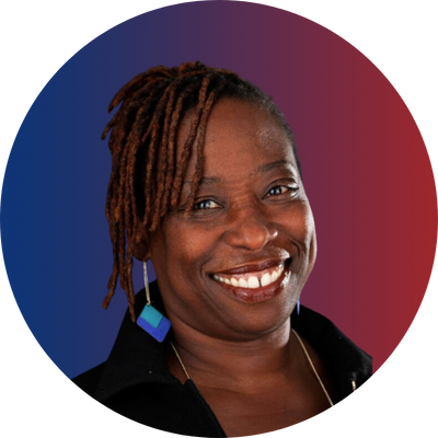 Smiling woman with dreadlocks, wearing a black top and blue earrings, against a red and blue gradient background.