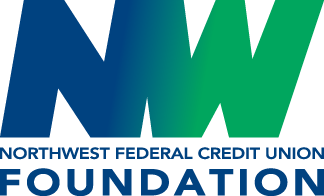 Bubble tea with black tapioca pearls in a clear plastic cup with a straw