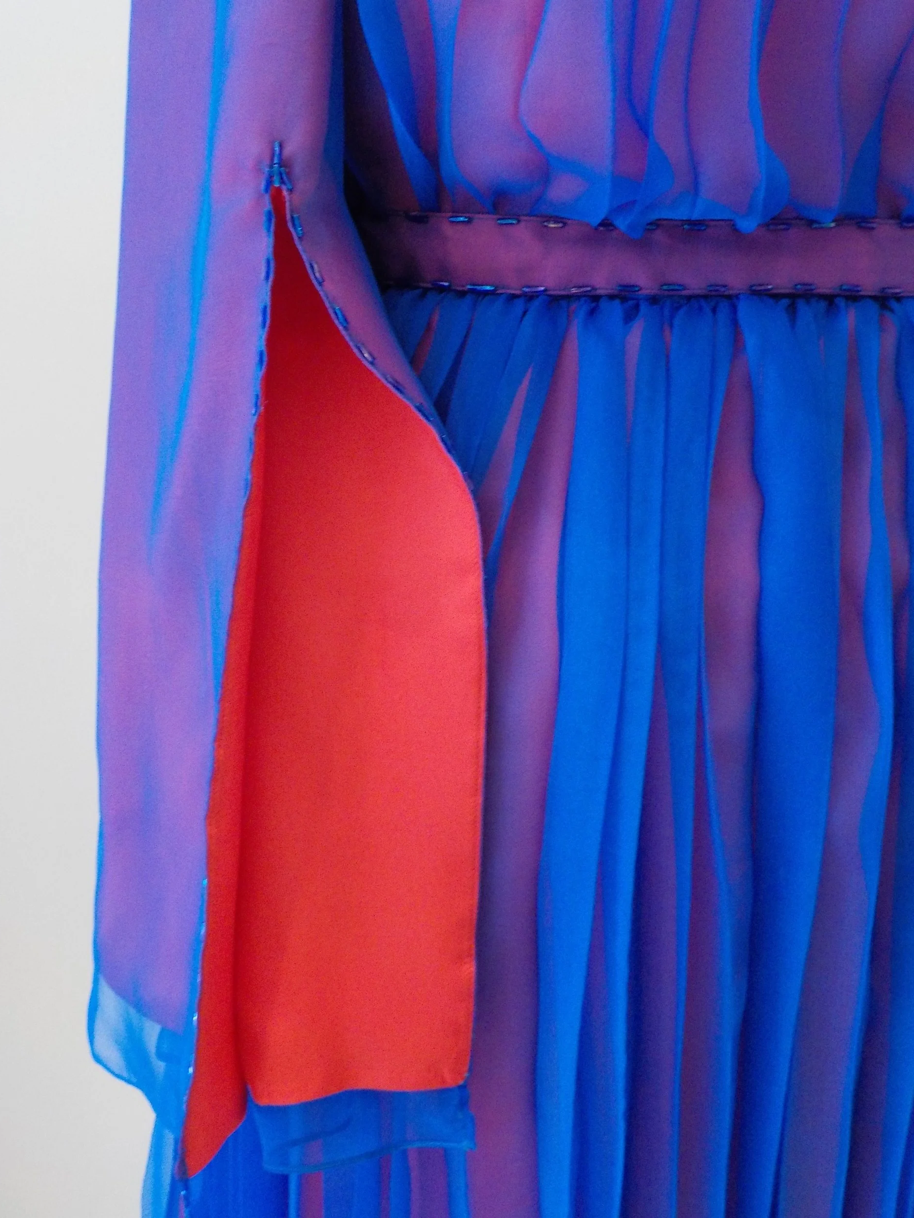 Red silk satin overlaid with silk pleated chiffon dress by Beatrice Espinosa