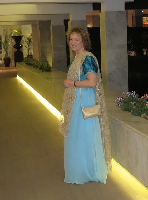 Bespoke Wedding guest dress and matching gold embroidered shawl by Beatrice Espinosa worn by client.