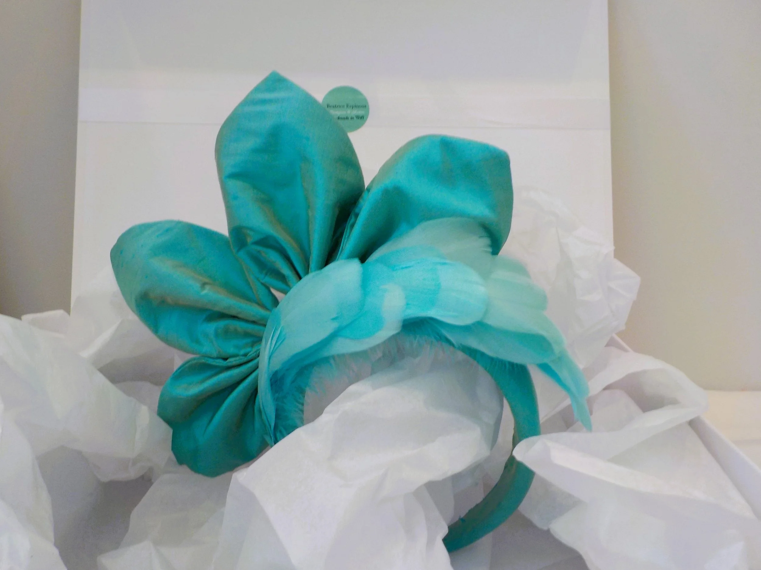 Bespoke aqua silk with feathers matching headband