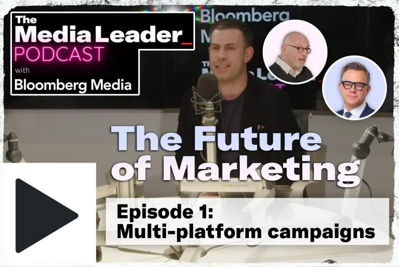Recording studio for Bloomberg Media's podcast titled "The Media Leader." Three hosts or guests are present, with one speaking into a microphone. The podcast's episode is "The Future of Marketing," focusing on multi-platform campaigns, and features an image inset of two individuals.