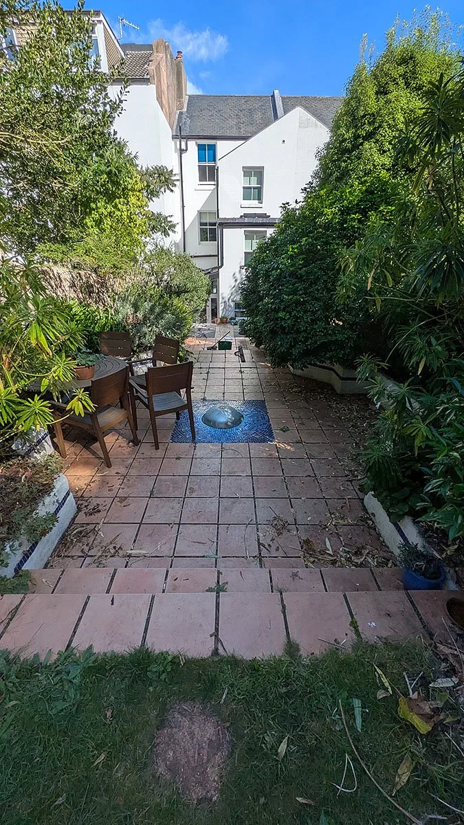 Old paving, overgrown garden