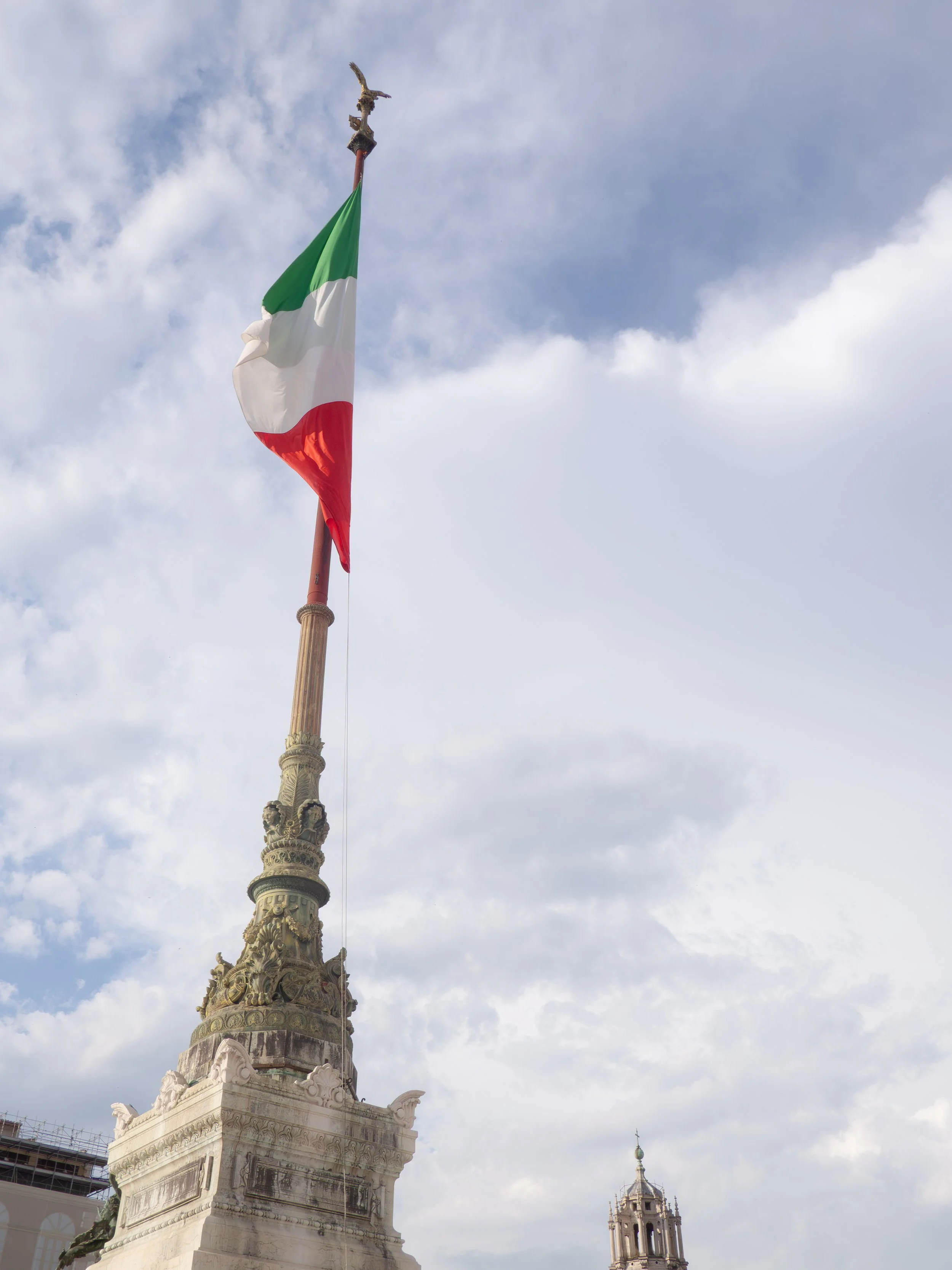 Italian Flag Flying Above Altare della Patria Monument in Rome.jpg