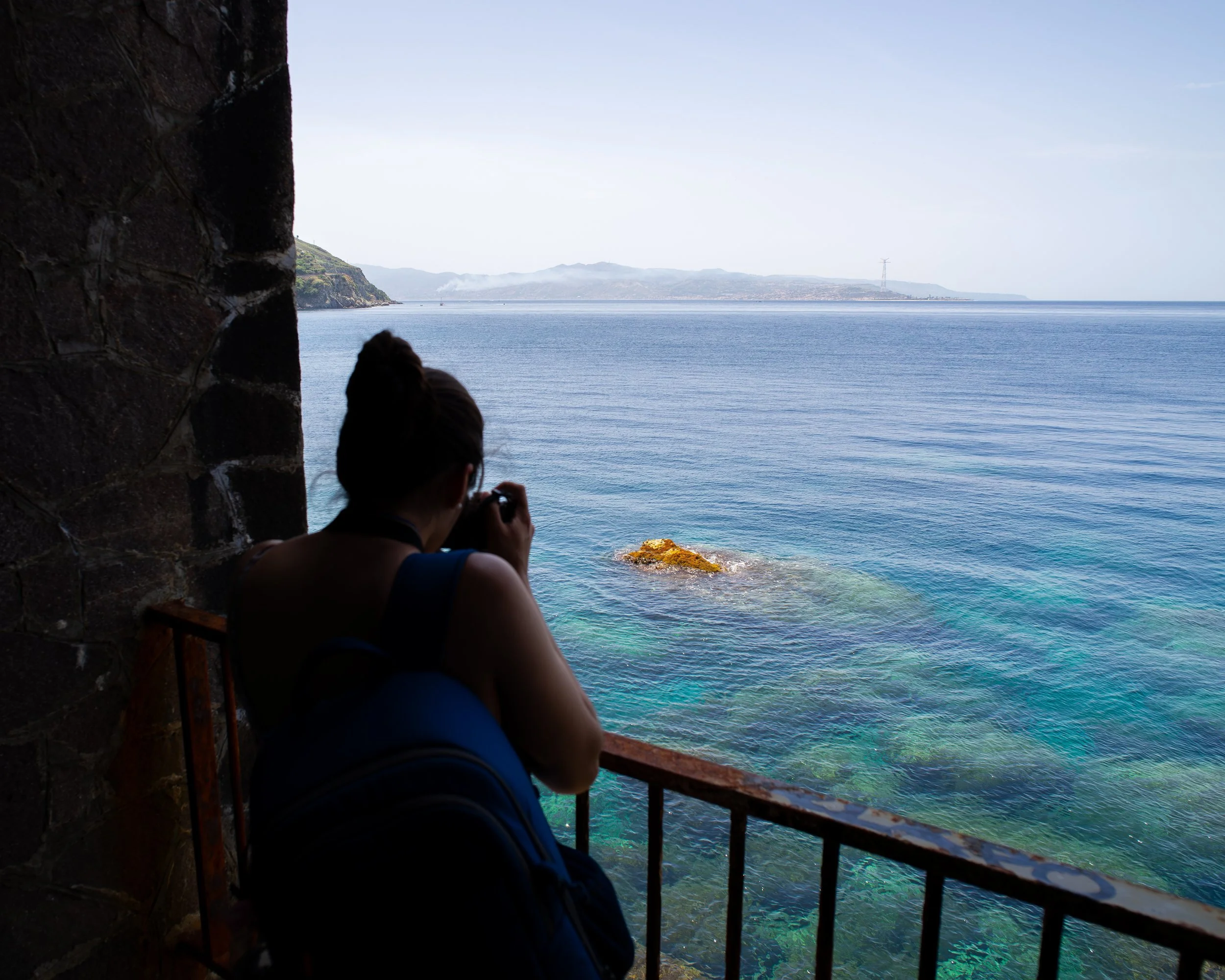 Photographer Capturing Coastal View in Scilla, Italy.jpg