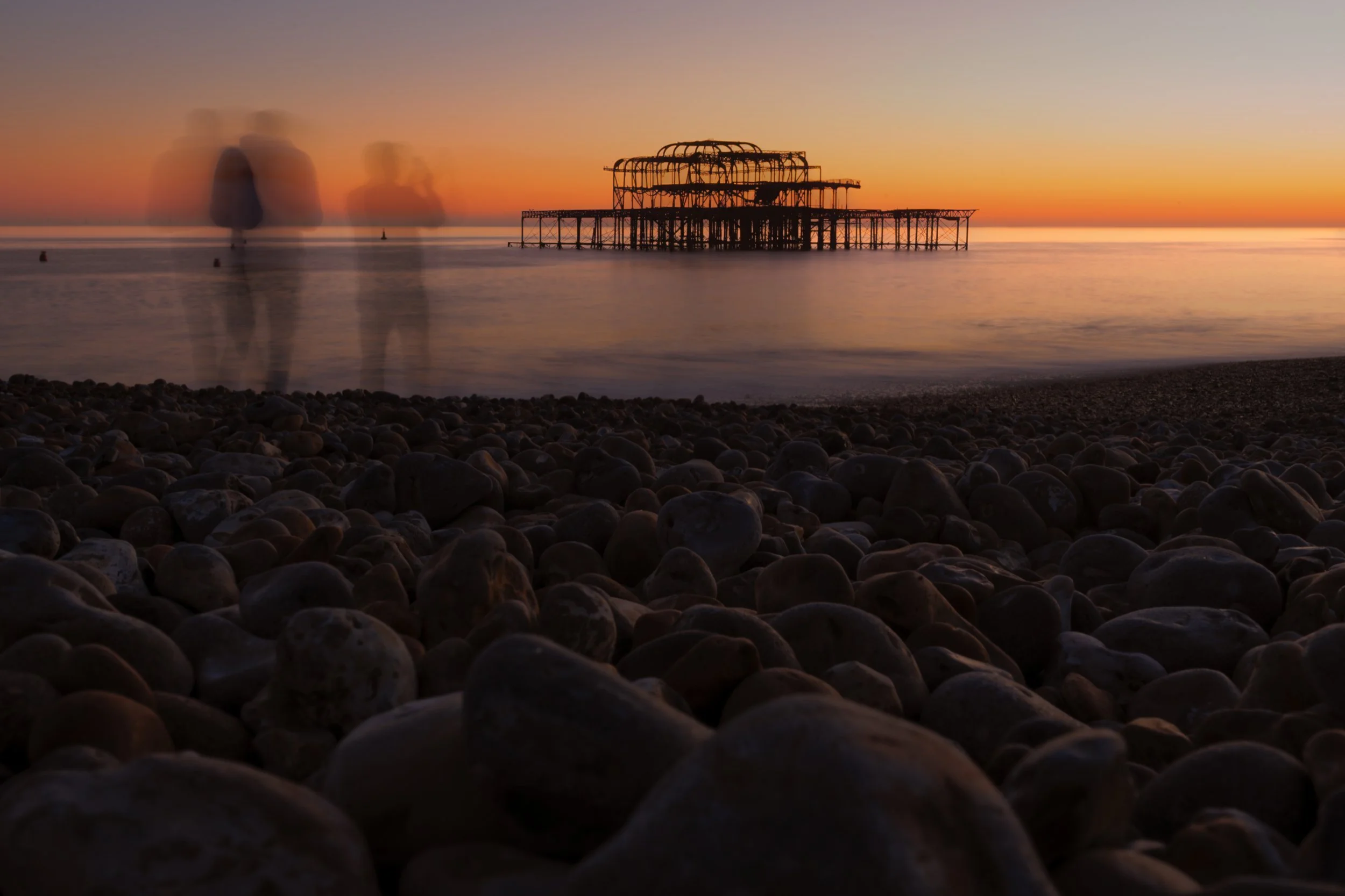 Ghostly Figures on Brighton Beach at Sunset with West Pier.jpg