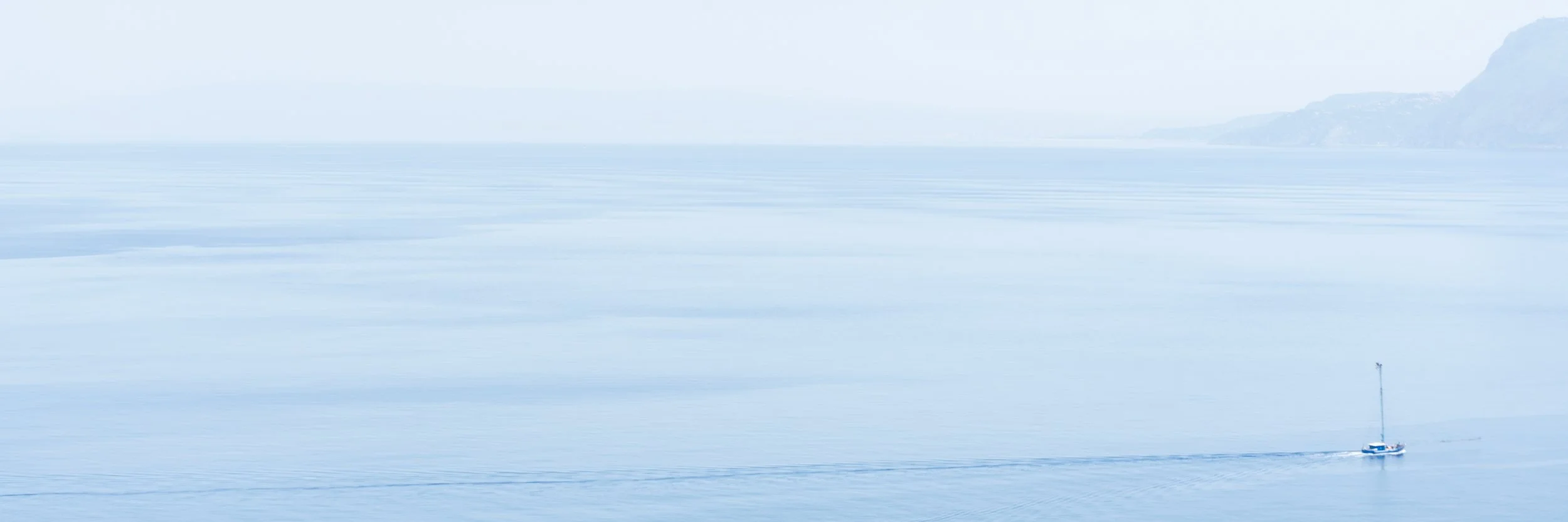 Minimalist Seascape with Sailboat off the Coast of Scilla, Italy.jpg