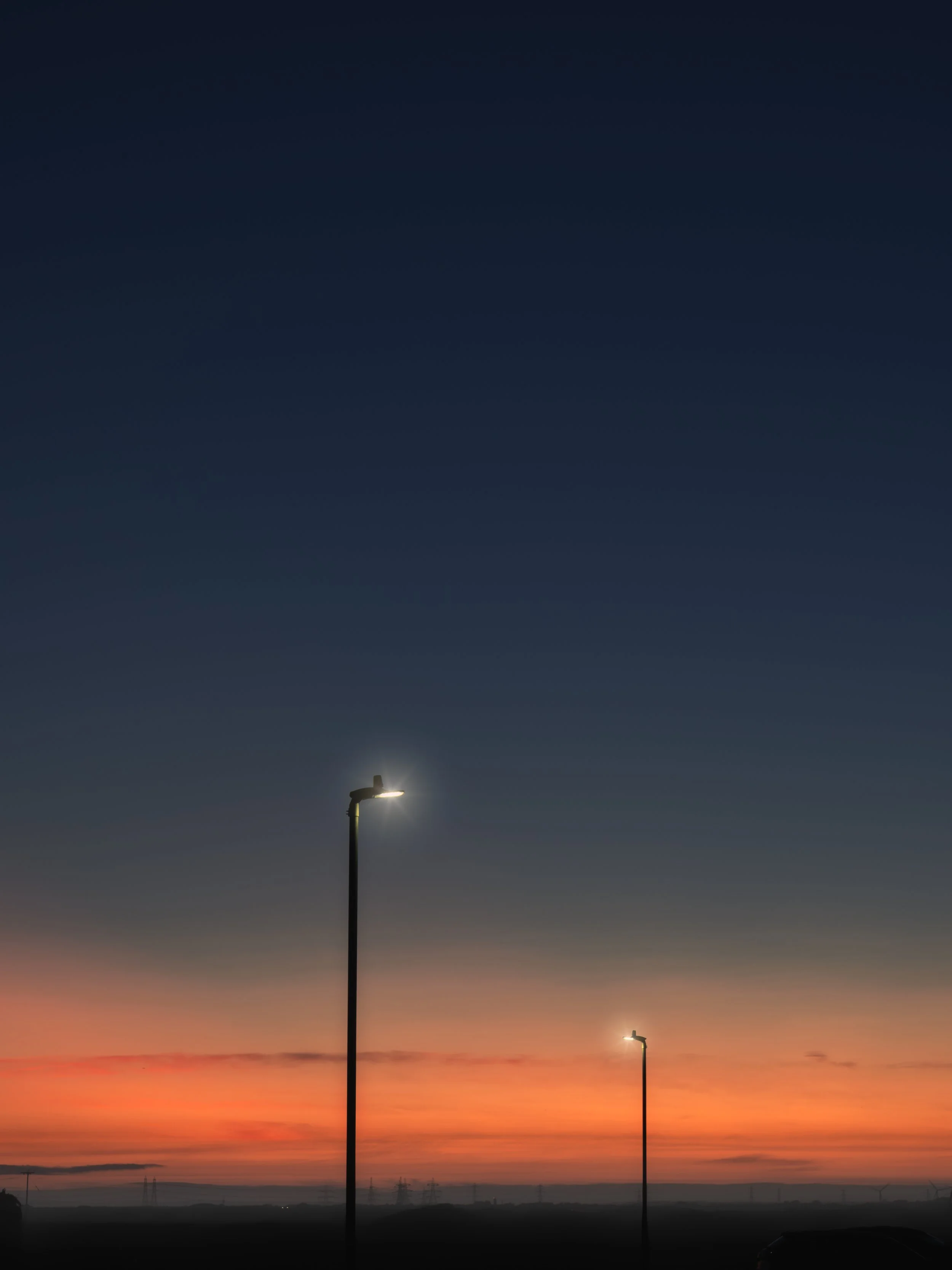 Minimal Street Lights Against Sunset Sky with Large Copy Space.jpg