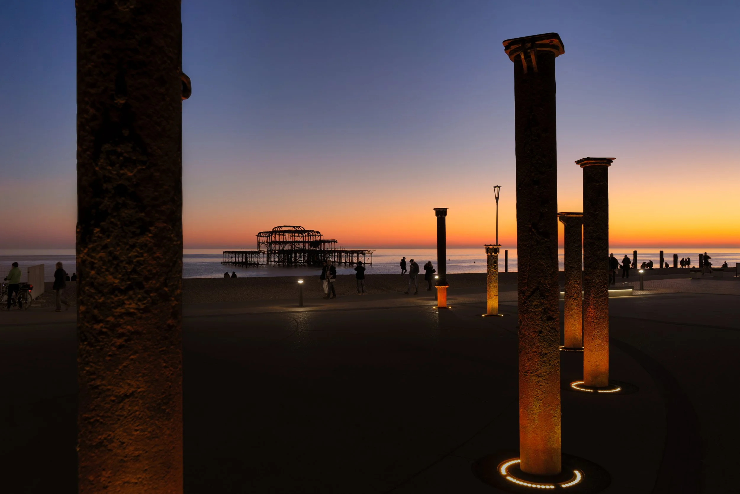 Brighton West Pier at Sunset Framed by Illuminated Columns.jpg