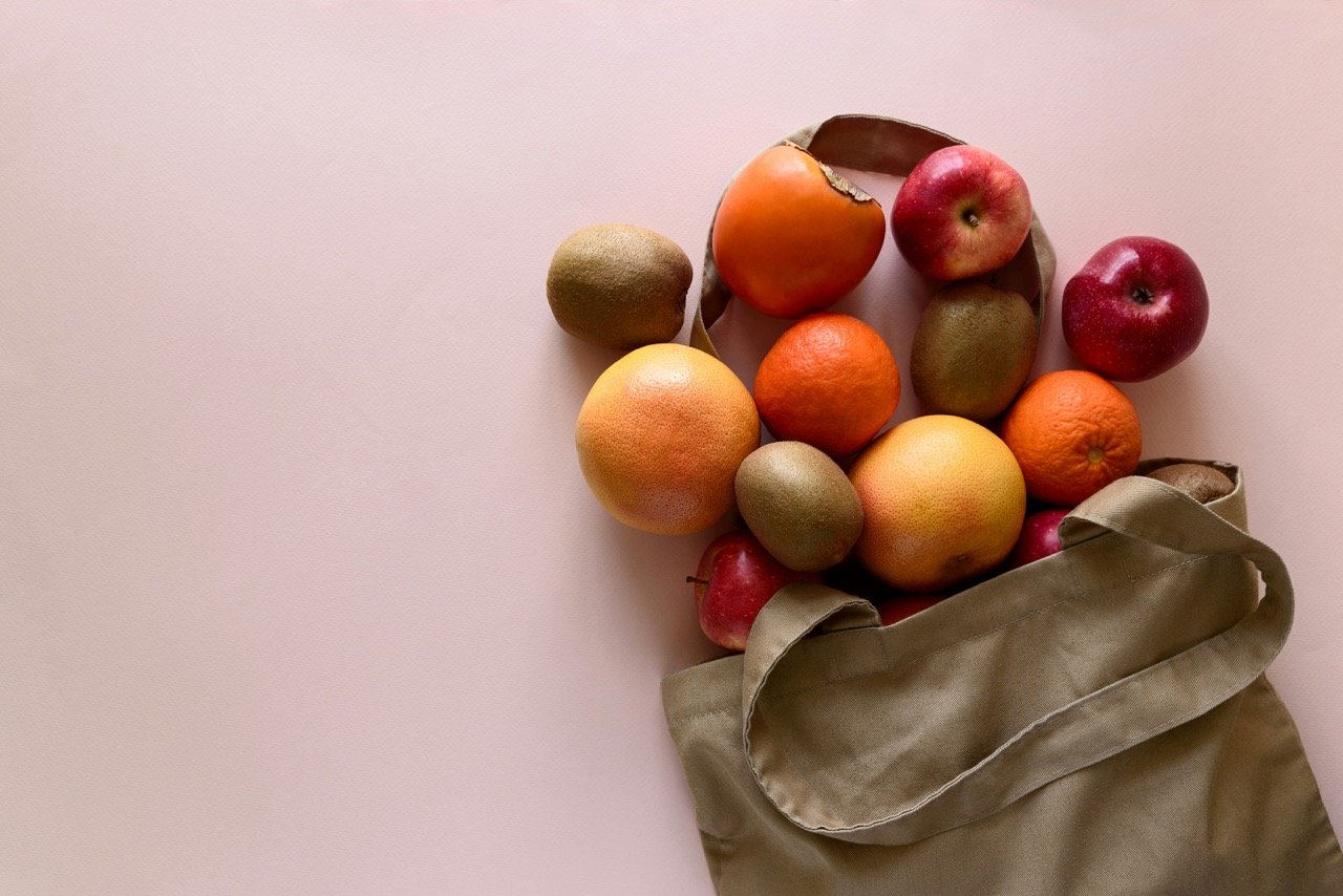 bag-of-fruits-apples-grapefruits-and-persimmons