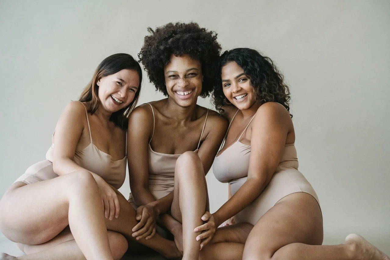 three-natural-women-posing-for-body-neutral-wellness