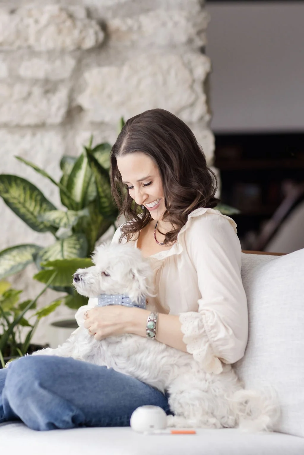 period-recovery-coach-holding-white-dog