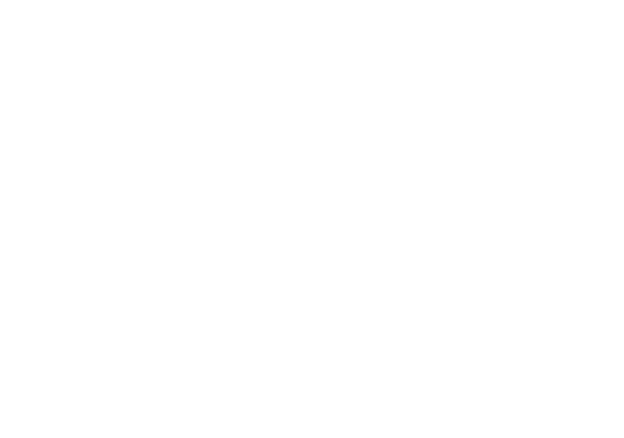 Circular logo of an Indigenous woman looking through a camera lens, framed by a bog laurel flower.