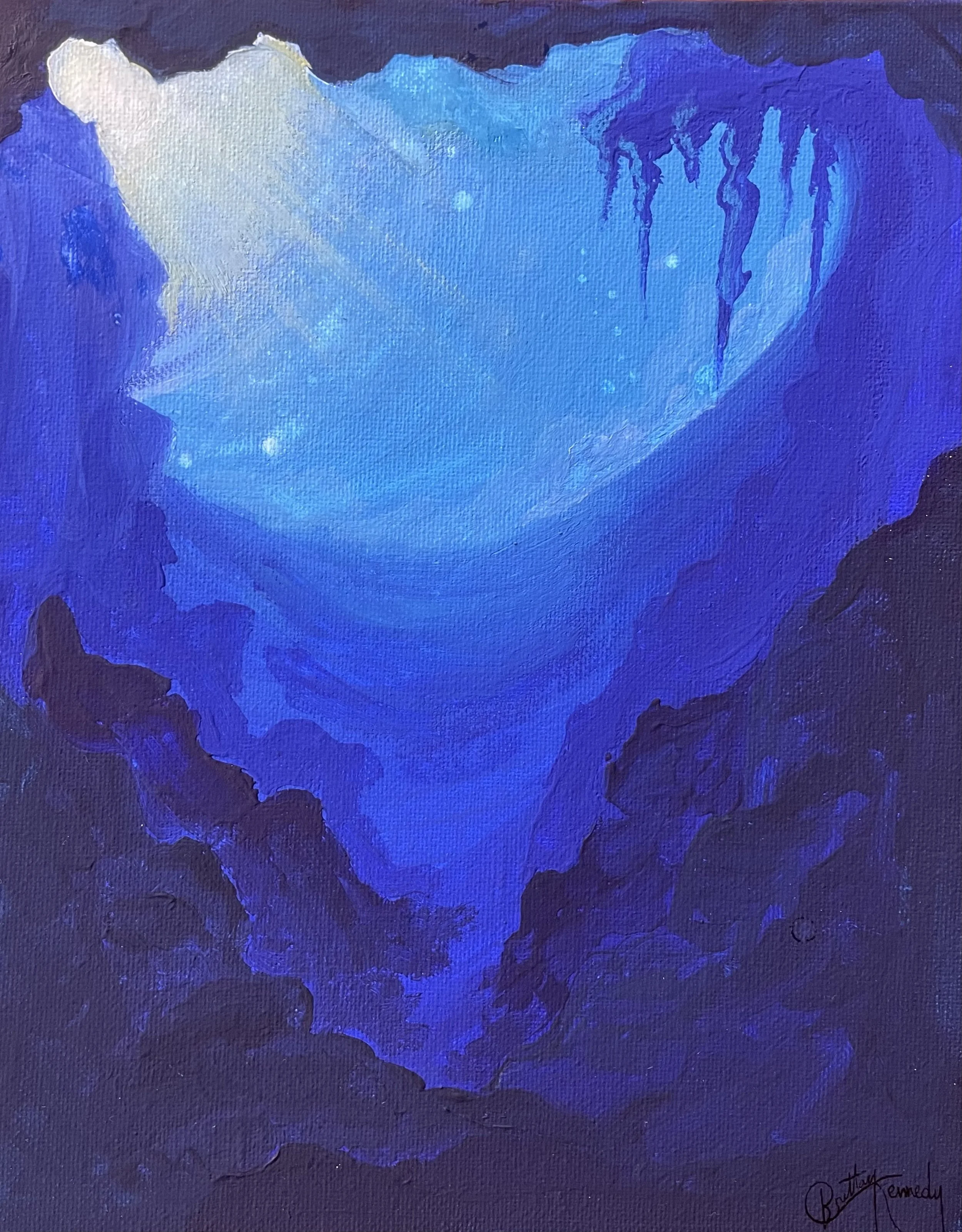 A painting of a deep, glowing blue ice cave illuminated by an opening at the top, with icy formations hanging from the ceiling and rugged dark rock walls surrounding the icy interior.