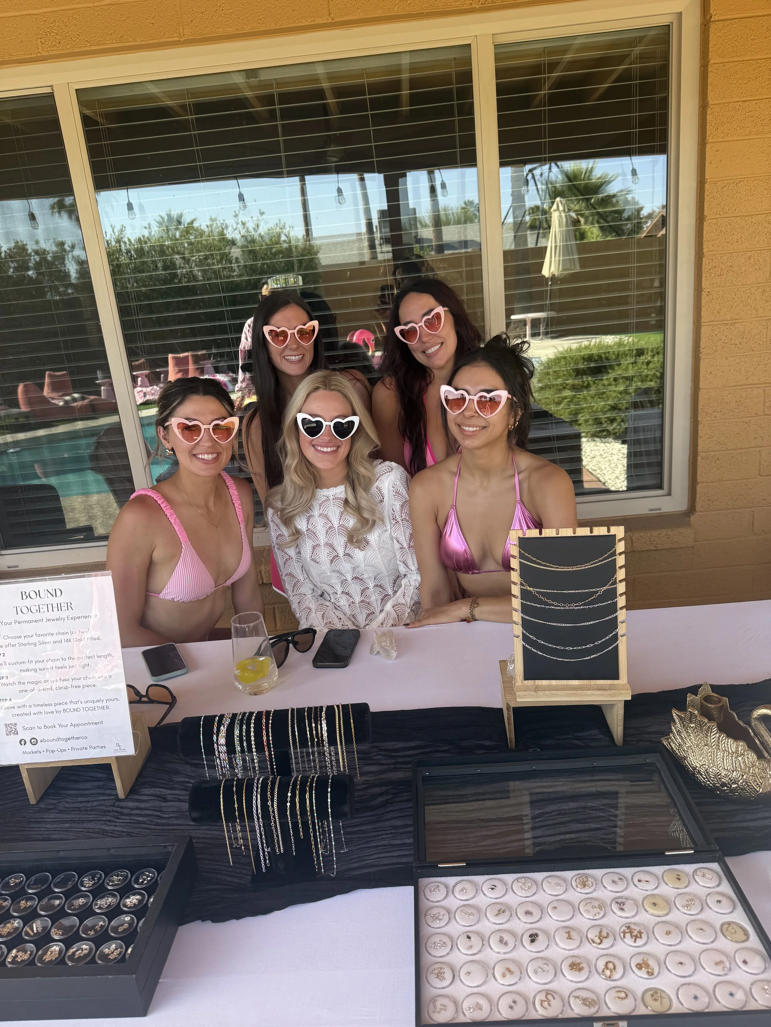 bachelorette party with bride, bridesmaids getting permanent jewelry