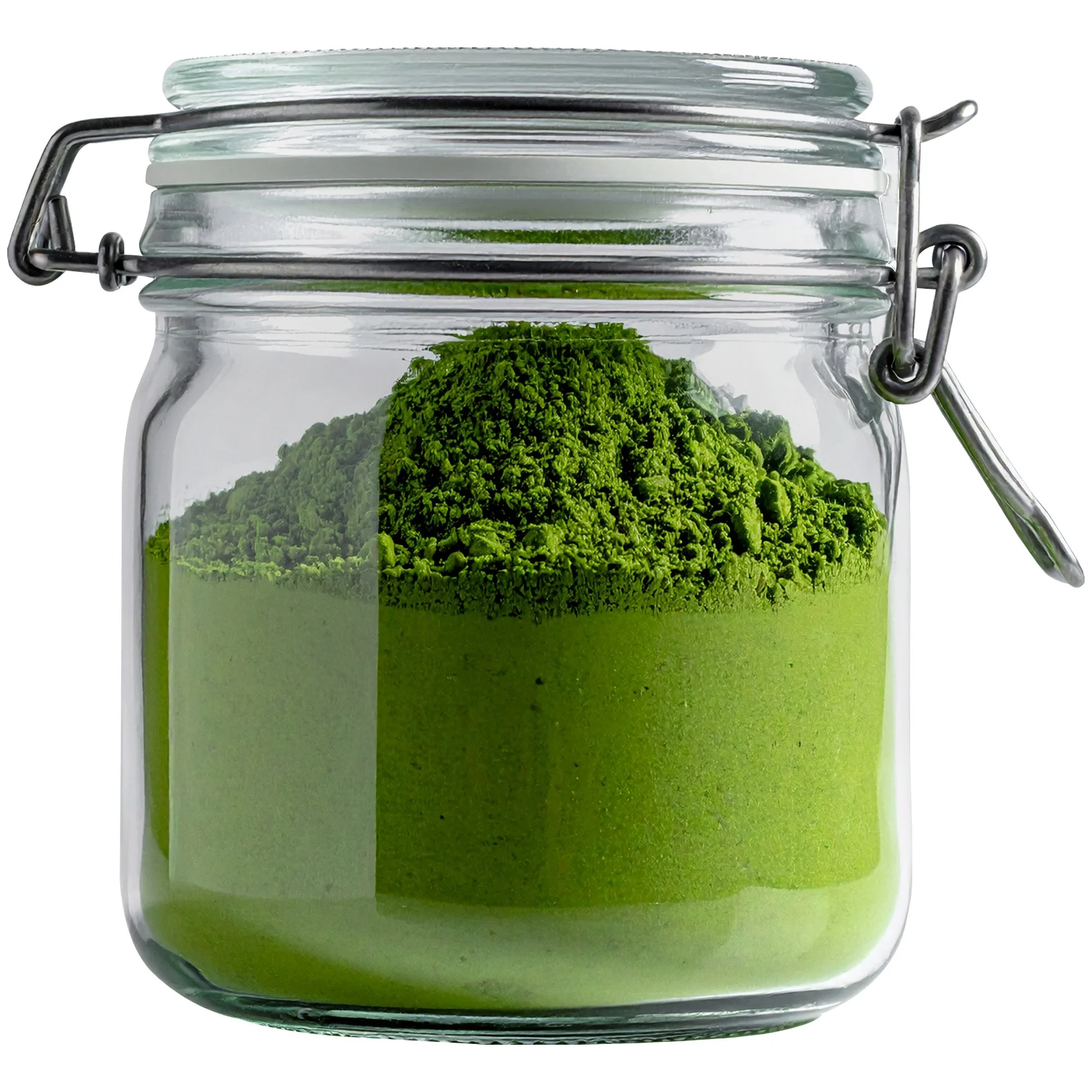 A glass jar filled with bright green matcha powder, with some of the powder mounded at the top inside the jar.