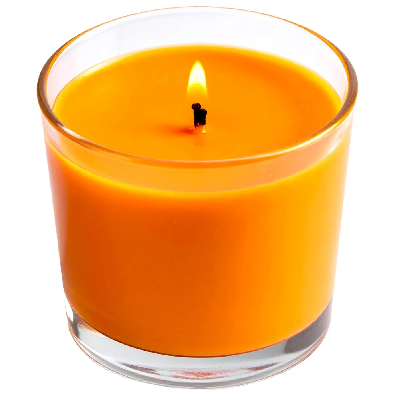 A lit orange candle in a clear glass container.