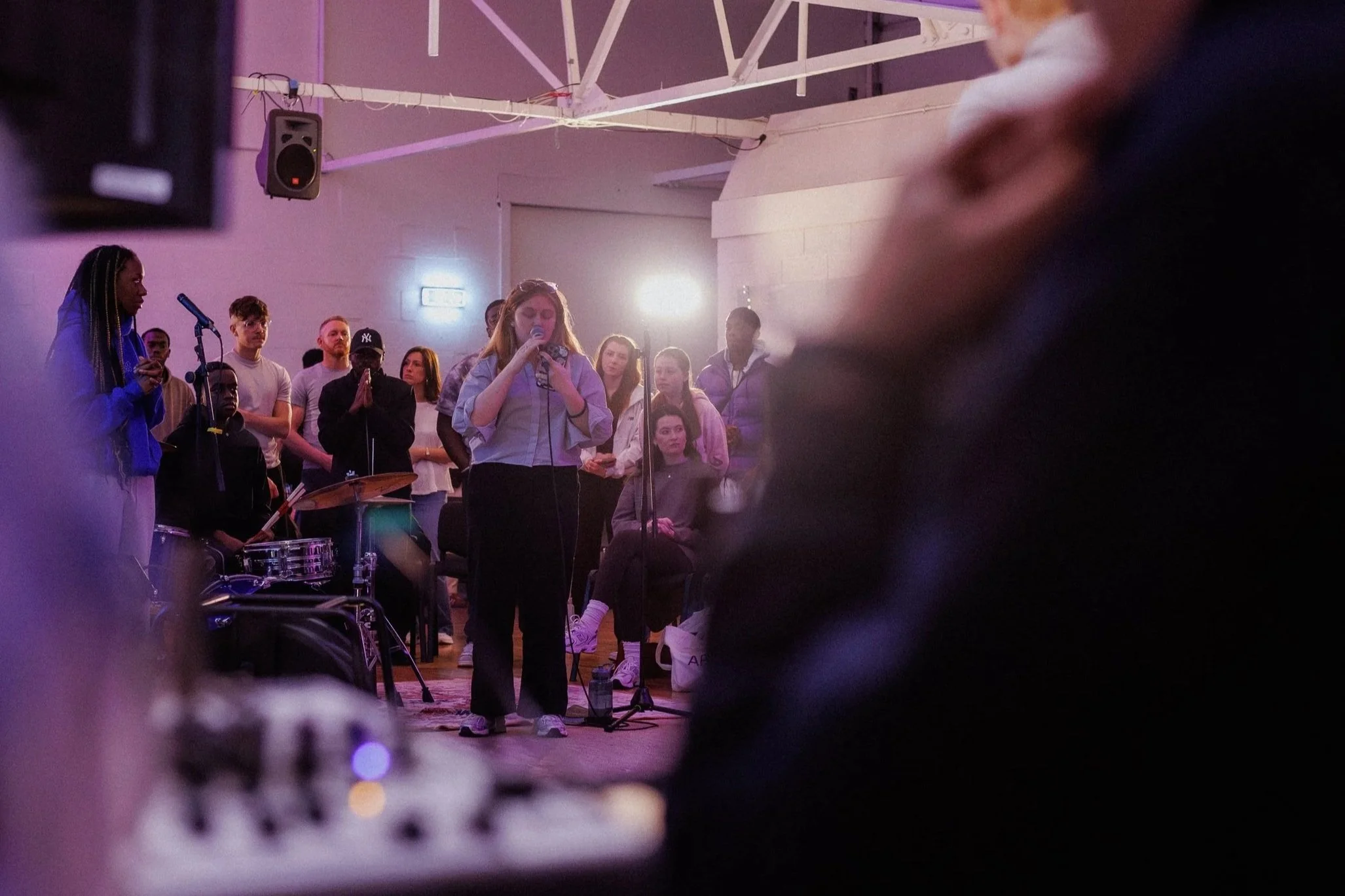 People worshipping together in Market Hall