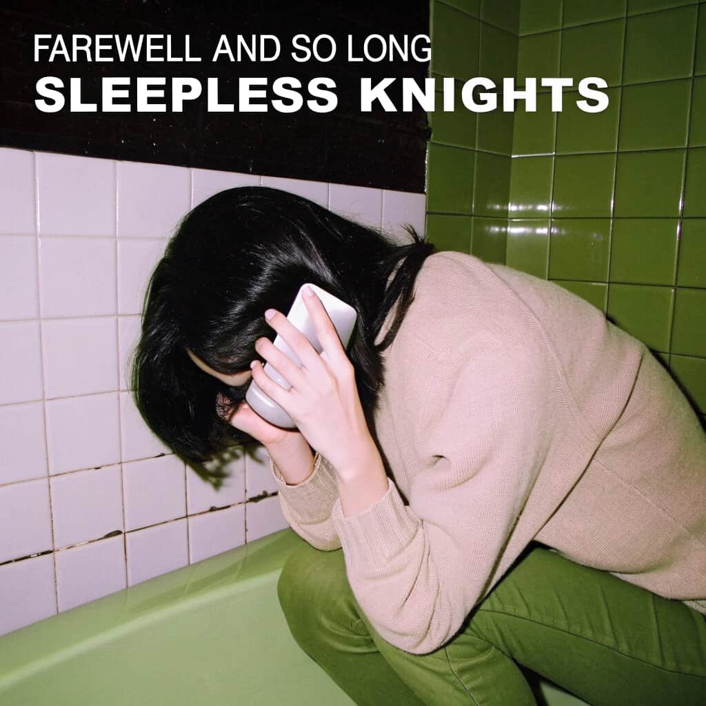 A woman with dark hair, wearing a beige sweater, sitting in a green-tiled bathroom, holding her head with one hand and a phone in the other, appearing distressed. Text overlay reads: "Farewell and so long sleepless knights." Song by JLynn theWriter.