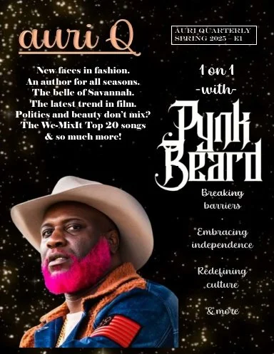 Cover of Auri Q's quarterly magazine, Spring 2025, featuring a portrait of a man with a pink beard, wearing a beige hat, a blue jacket with patches, and a brown scarf, against a black background with white text highlighting articles. JLynn theWriter