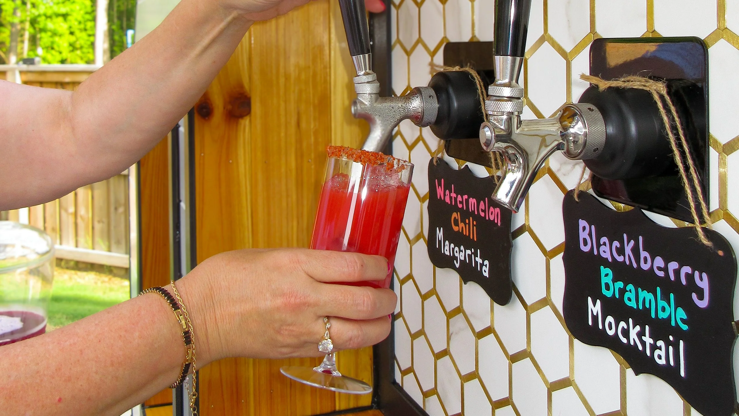 BeesWings Mobile Drinkery Watermelon Chili Margarita being poured