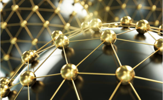 Abstract illustration of a molecular network with gold-colored spheres connected by thin lines.