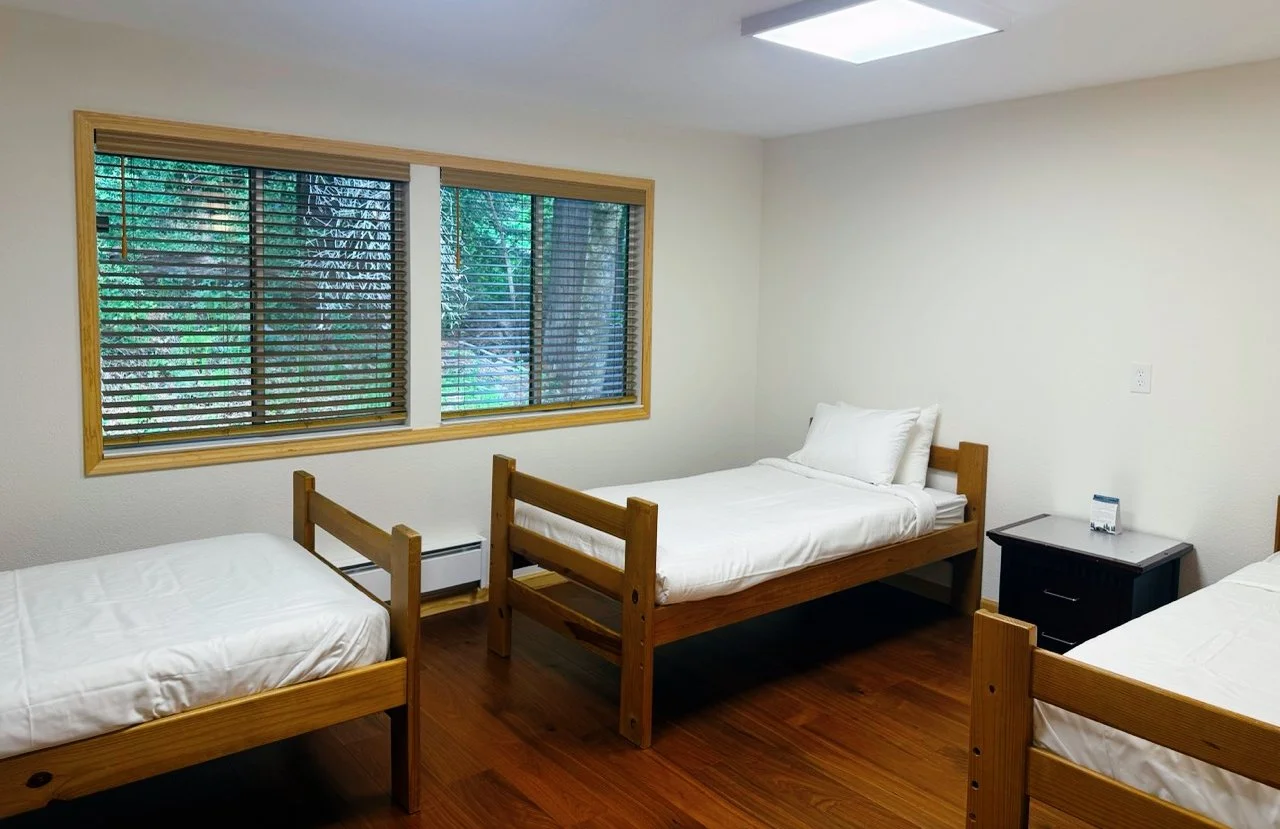 A Twin Room at the Lodge at Camp Coffee Shop. Most rooms have two beds, a couple have three or four, perfect if you're attending with friends or coworkers.